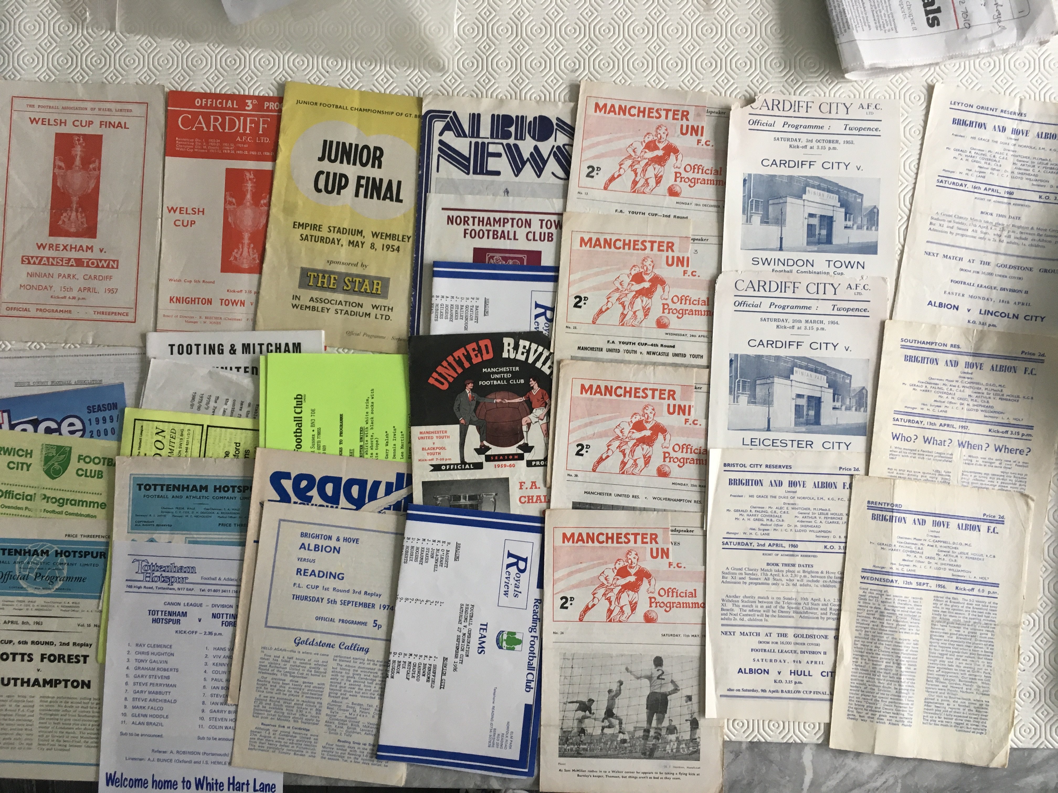 Football Programme Selection: Wide range to include 1957 Welsh Cup Final, Late 50s Brighton home reserves, Man Utd reserves/youth 62/63 with tokens missing and more. Fair condition overall with instructions to sell. (31)