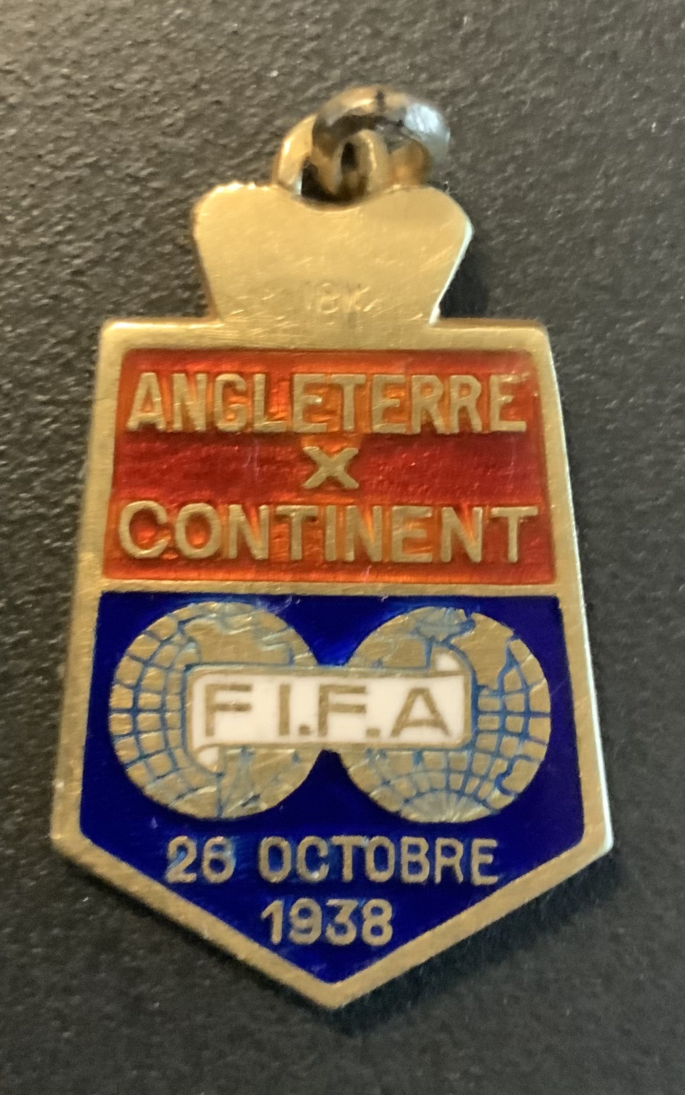 1938 England v Rest Of Europe Football Medal: Players participation medal for the match at Arsenal on 25 10 1938. To celebrate 75 years of the Football League. Has 3 Lions to rear with enamel front stating Angleterre v Continent with FIFA and date. Small medal with ring suspension does not have a hallmark.