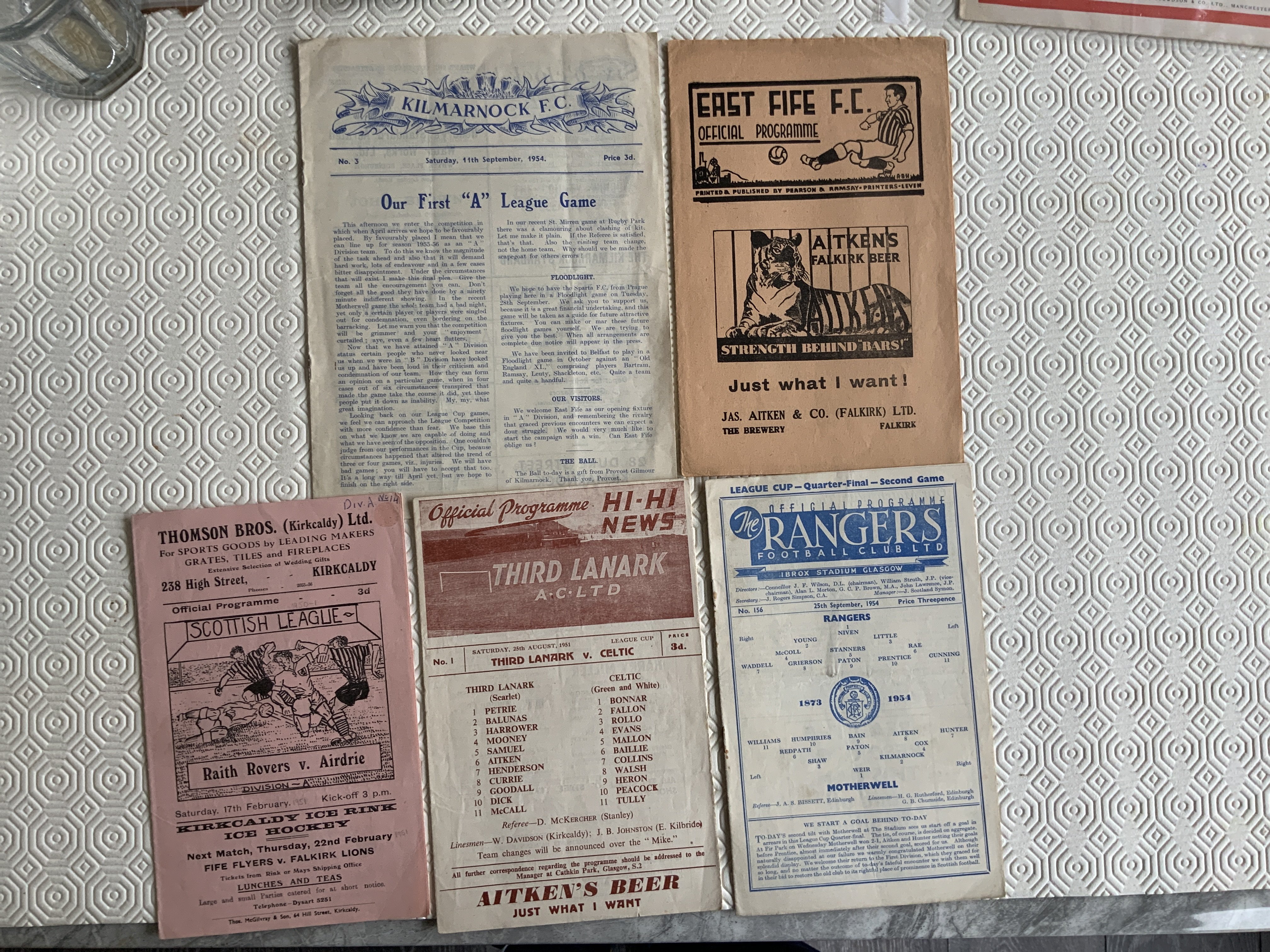 1950s Scottish Football Programmes: 50/51 Raith v Airdrie, 51/52 Third Lanark v Celtic, 54/55 Rangers v Motherwell, Kilmarnock v East Fife + 55/56 East Fife v St Mirren. Very good. (5)