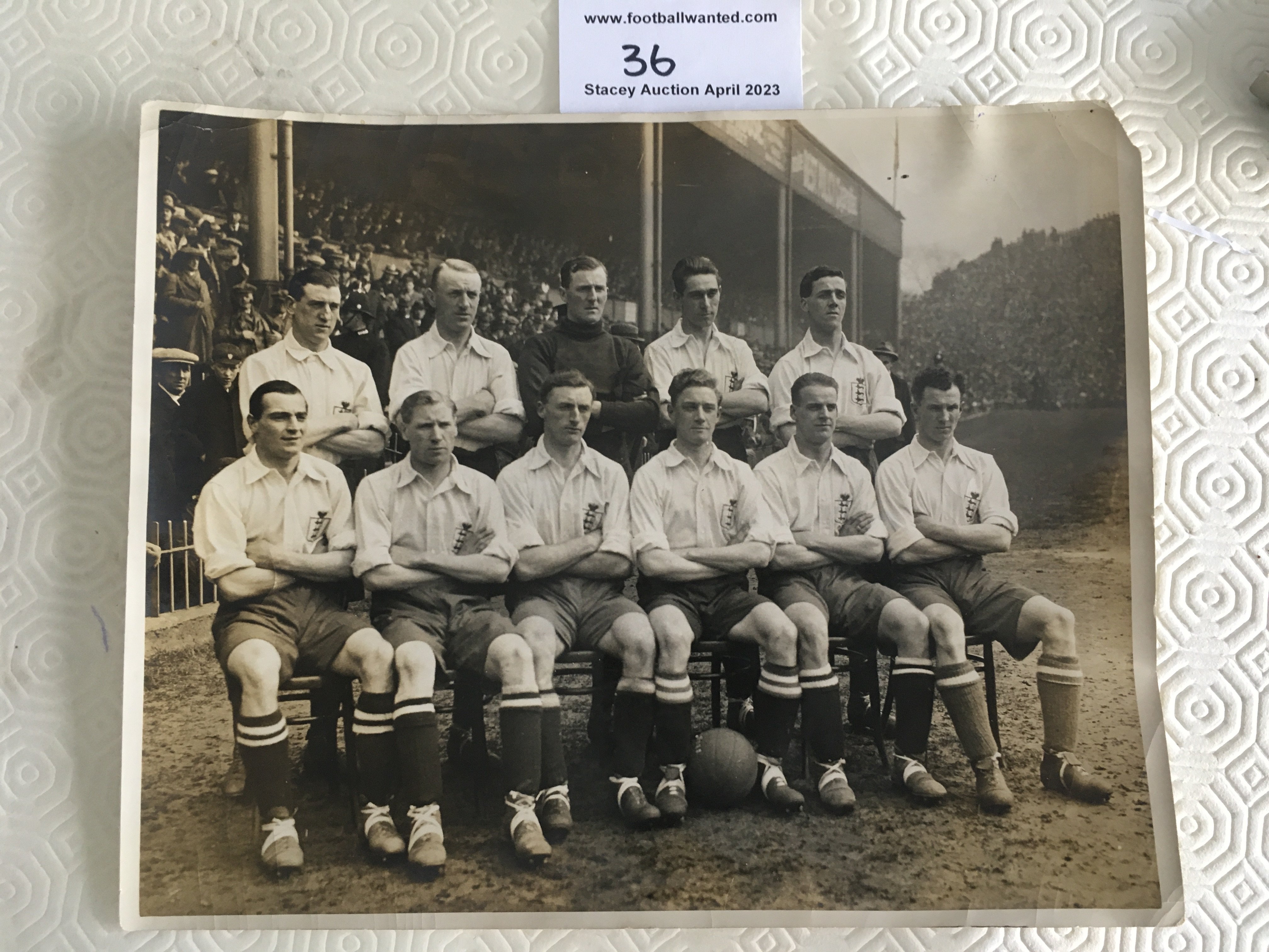 1922 England Team Press Photo v Scotland: Original 10 x 8 inch press photo picturing all 11 players in kit on the pitch at Villa Park before the match with Scotland. Press stamp and players identified to rear. Very good with tiny piece out of border.