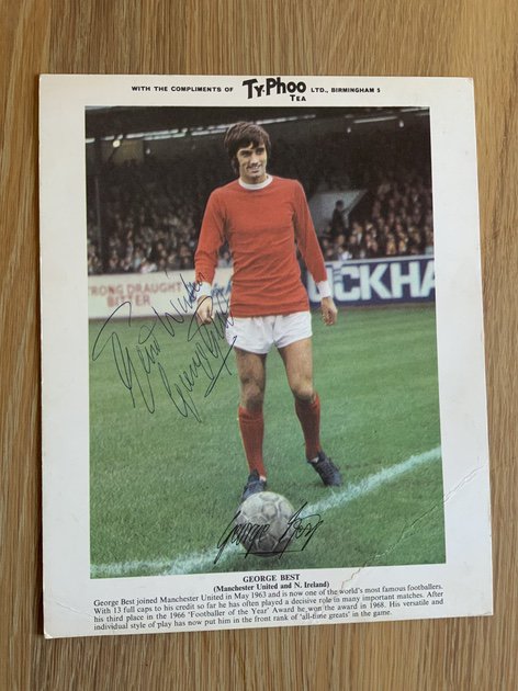 George Best Signed Manchester United Typhoo Tea Football Card: Hand signed 10 x 8 inch card neatly signed Best Wishes George Best in blue biro.