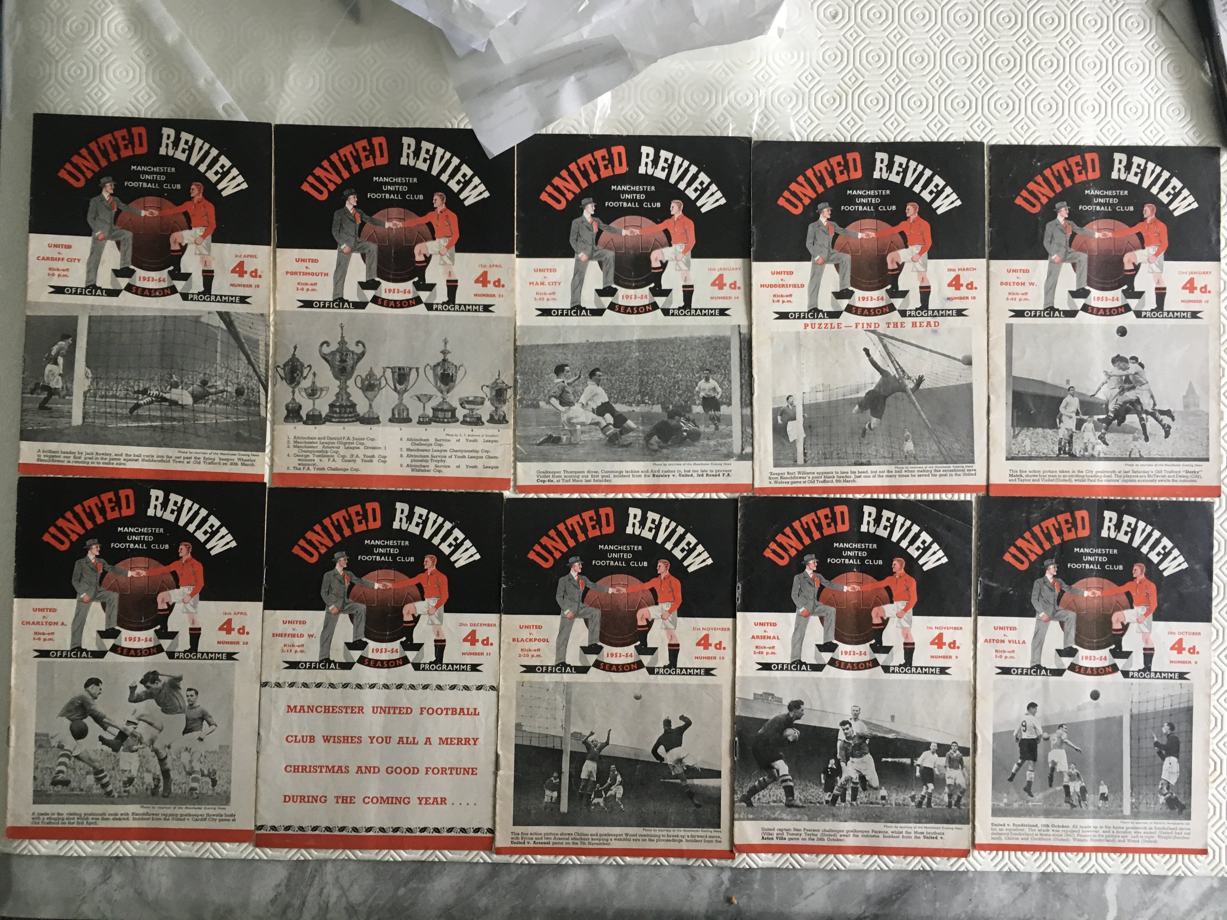 53/54 Manchester United Home Football Programmes: Includes Cardiff, Man City, Chelsea and Arsenal. Overall fair/good with a couple scuffed. (19)