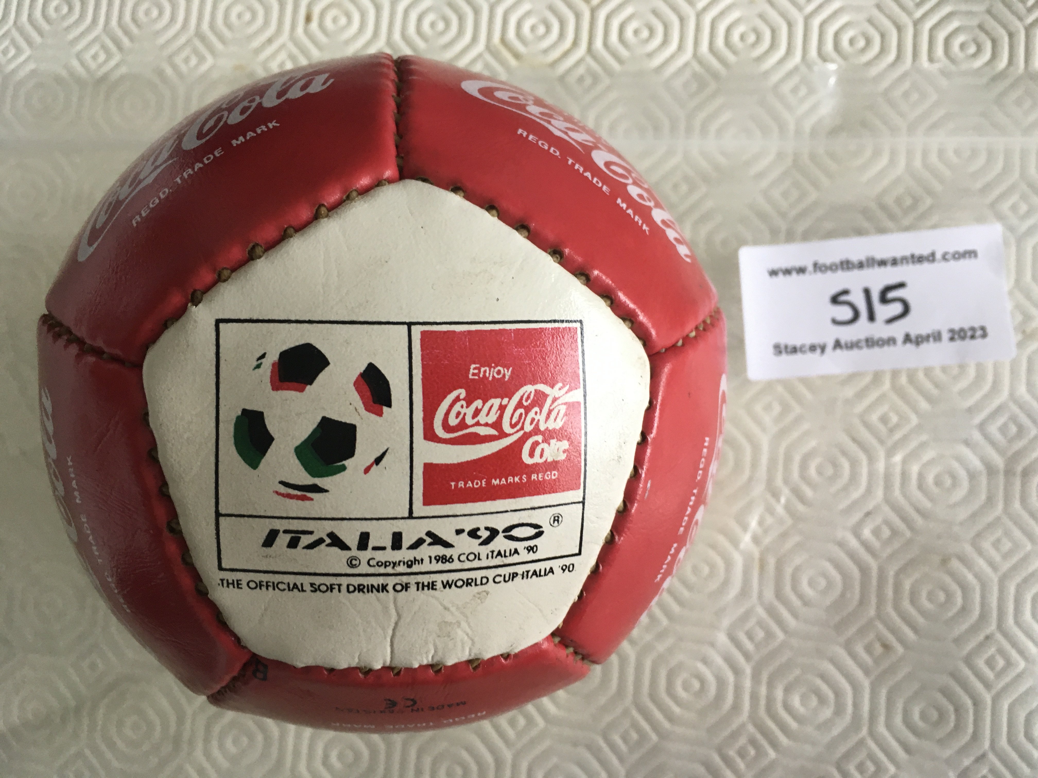 1990 Football World Cup Coca Cola Shop Promotion Memorabilia: A small ball with Coca Cola and Italia 90 logo along with unused large stickers for Fanta Lilt and two different Coca Cola with backing still attached. Stickers are from the period and not related to World Cup.