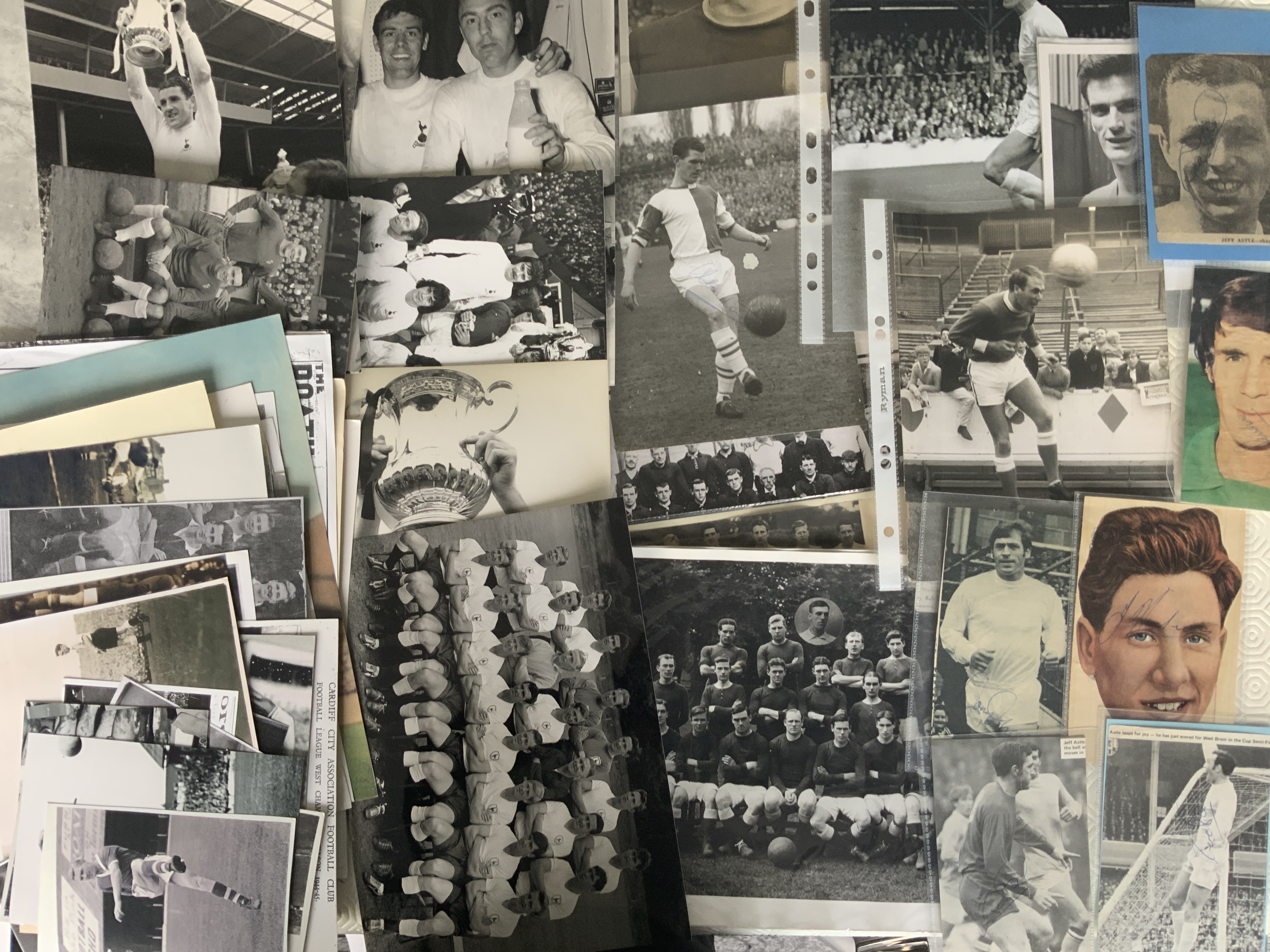 Football Memorabilia Box: Books to include Best Of Charles Buchans Monthly, quantity of replica photos with wide range of sizes and teams including Tottenham, few press photos including signed Ronnie Clayton, 47/48 New Brighton original large mounted photo with edge of card tatty not affecting photo, 14 A + BC Quiz football cards good Hereford content including programmes plus 1958 Roy Of The Rovers annual autographs including Astle and more.