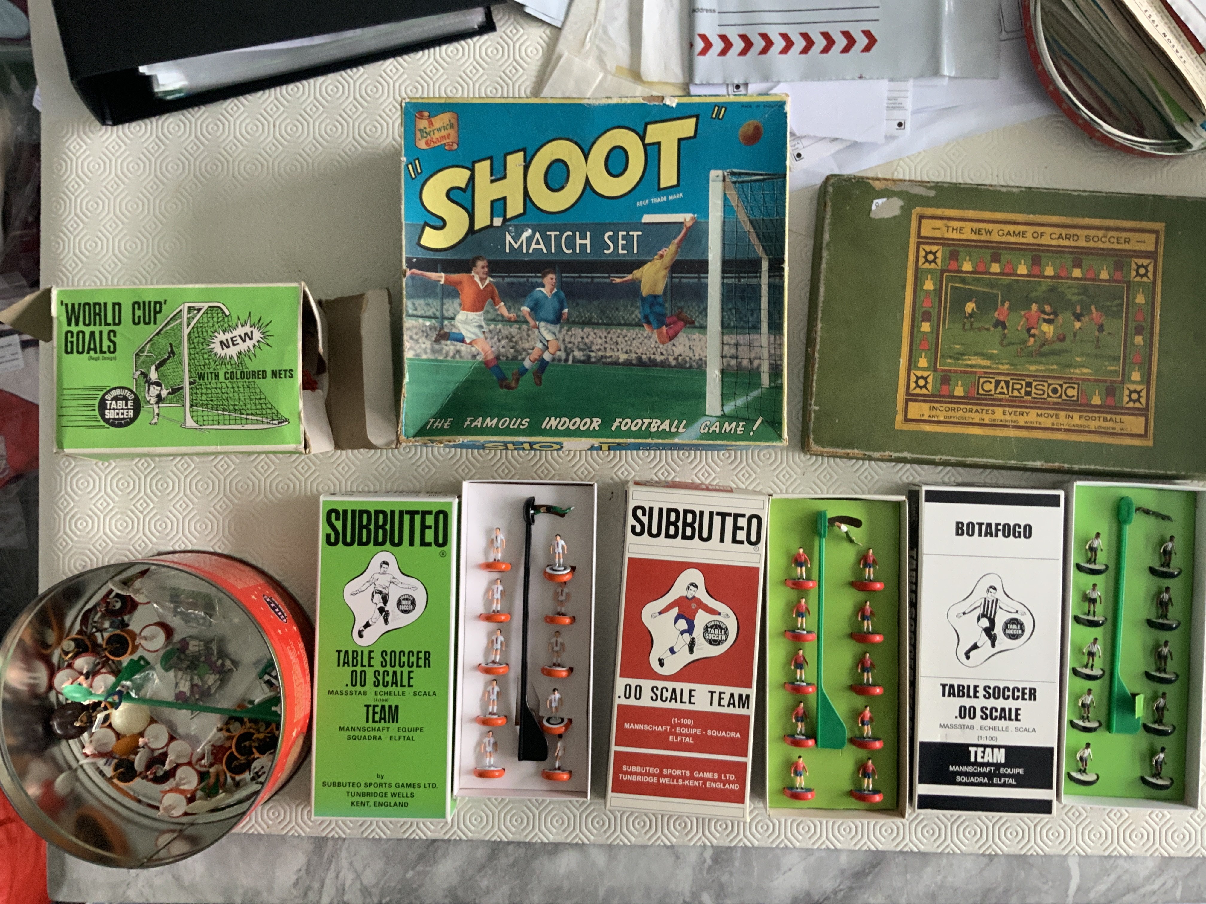 Subbuteo Football Collection: Includes 4 pitches, stands, many sets of goals, 3 boxed teams, tin of loose players, scoreboards and many paper ephemera to include old catalogues, price lists, wall charts and much more. C/W two old Football games all unchecked. Quantity.