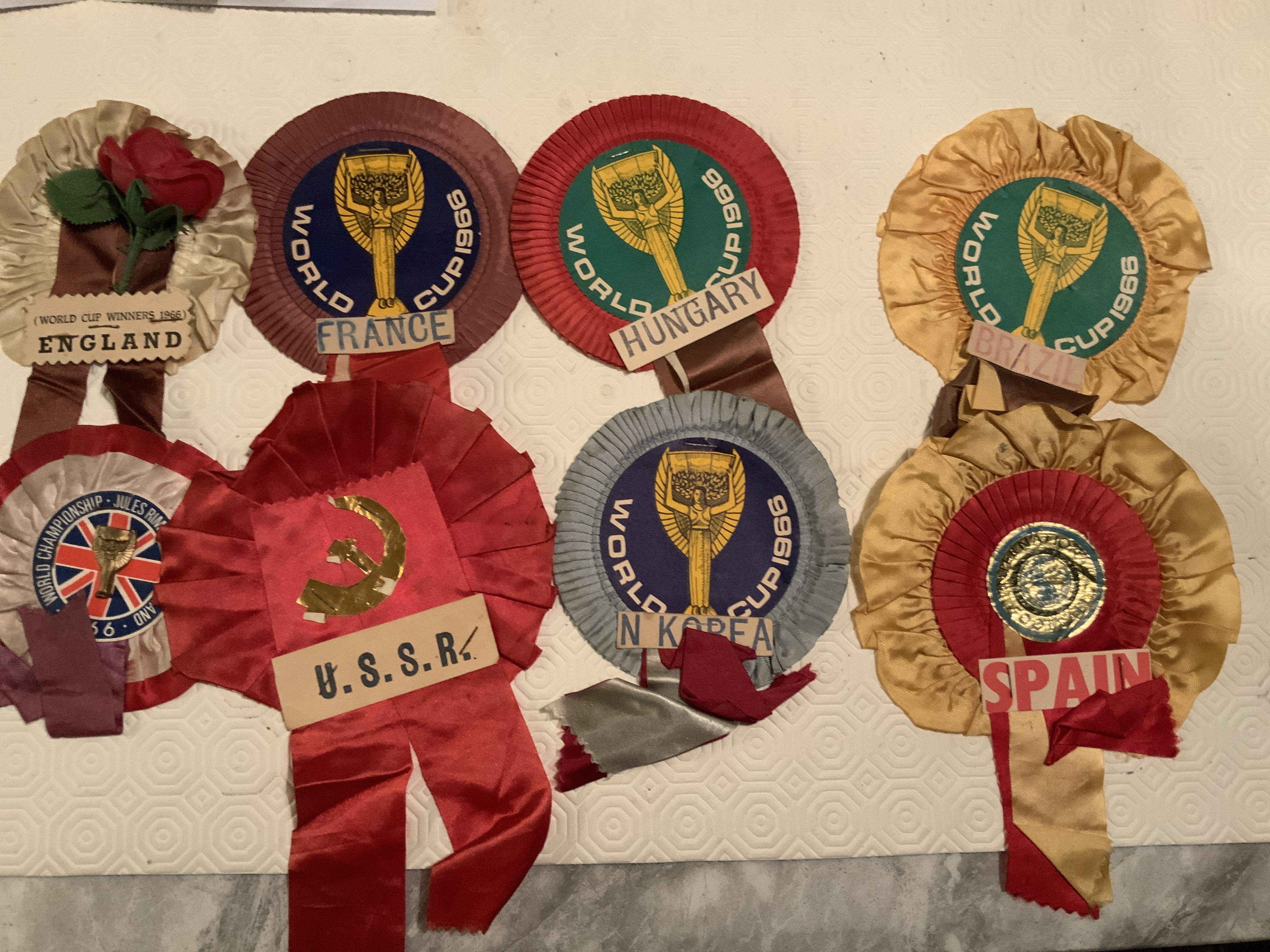 1966 World Cup Football Rosettes: Includes 2 different England plus France, Hungary and Brazil all stating 1966 World Cup, with Russia and Spain not mentioning World Cup. Good. (8)