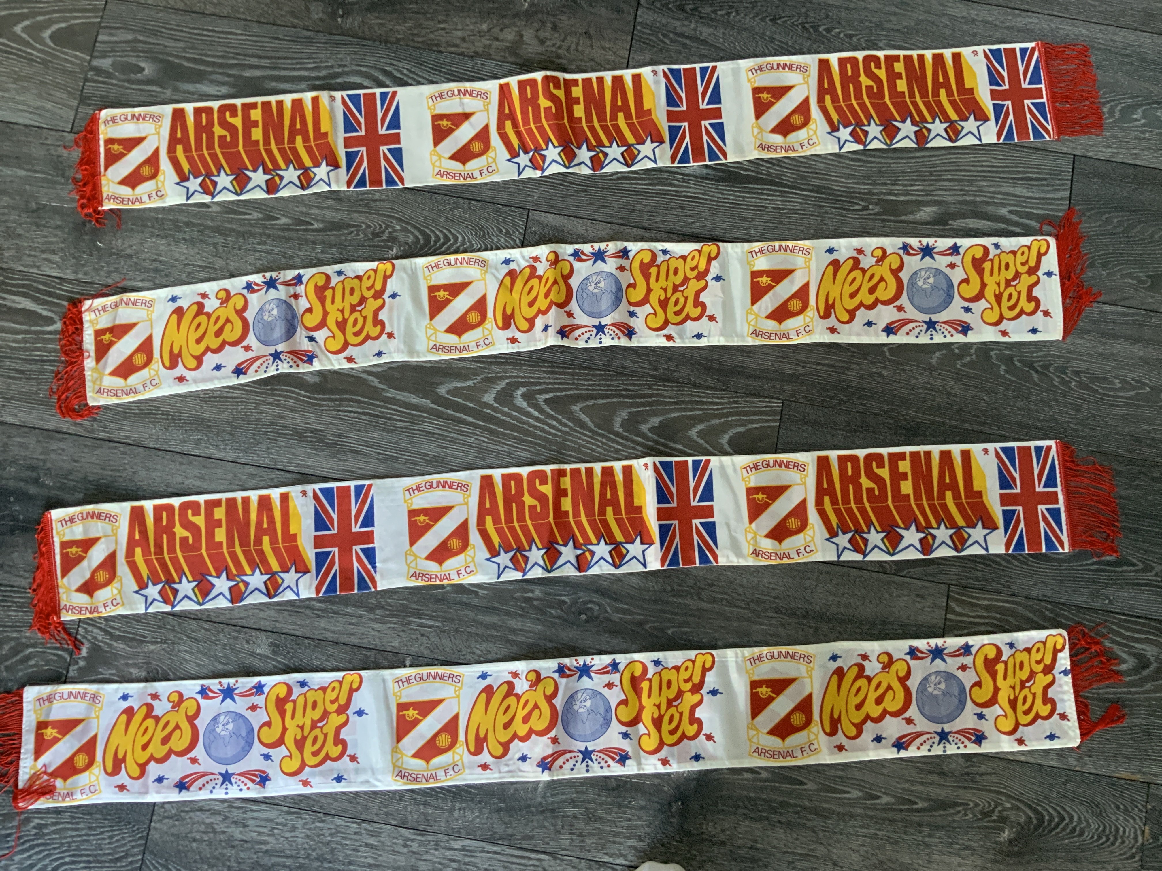 Bertie Mee Silk Arsenal Football Scarves: Mees Super Set mint condition silk scarves with The Gunners badge believed to be early 70s although possibly produced later. Reverse reading Arsenal with British flag. (4)