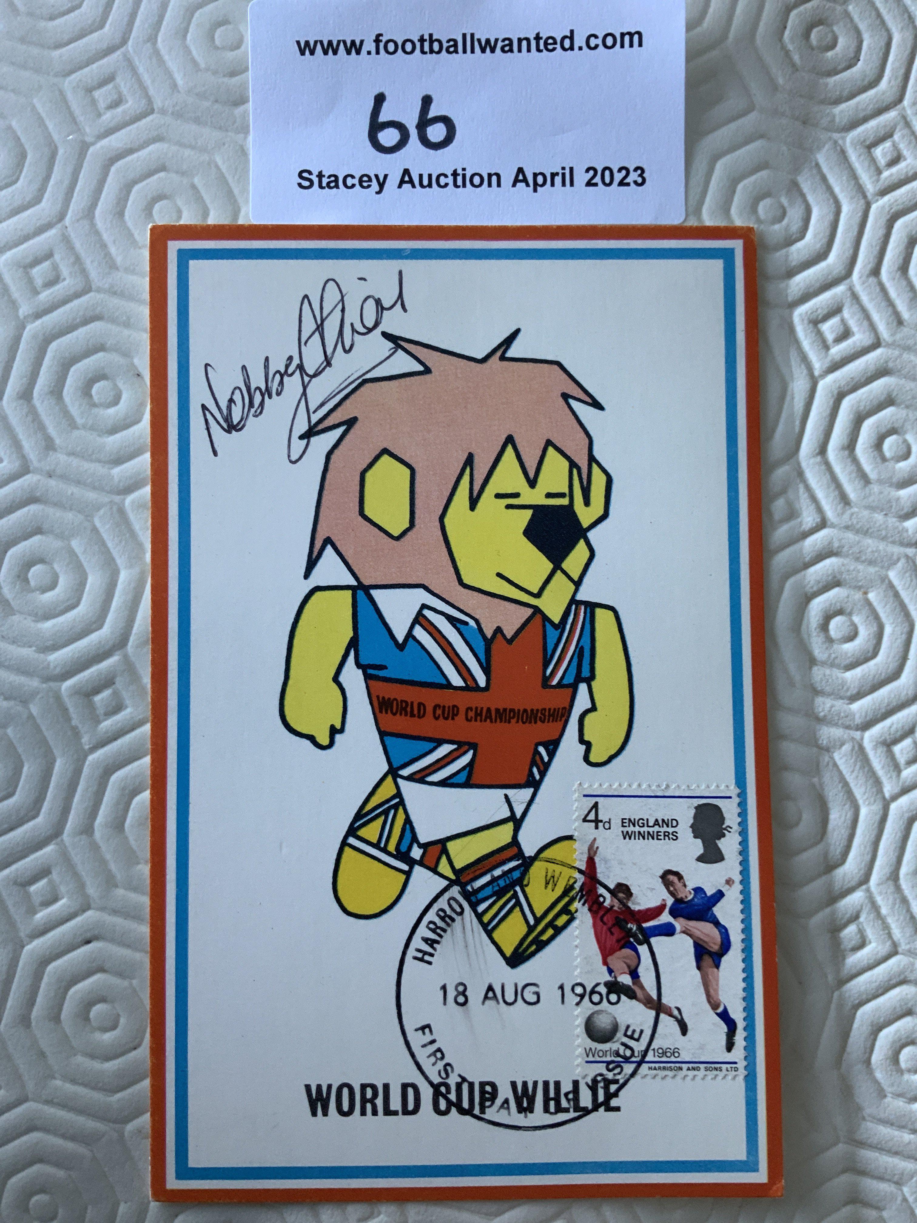 Nobby Stiles Signed 1966 World Cup Willie Postcard: Original unwritten postcard with FA 1966 to rear and stamped Cameo Stamps Ltd. WC Willie has first day of issue England Winners stamp 18 8 1966 and is hand signed by Stiles.