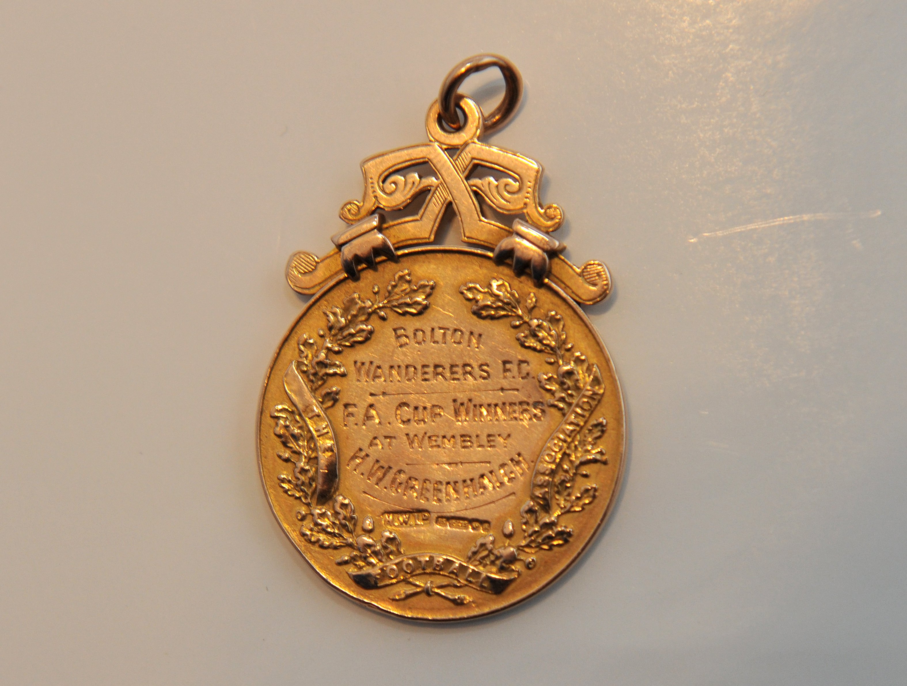Bolton Wanderers 1926 FA Cup Winners Football Medal: Issued to Harry Greenhalgh after defeating Manchester City in the final at Wembley. Gold medal with ring suspension and has been engraved with his name. Excellent without box. Direct from family so photos not included.