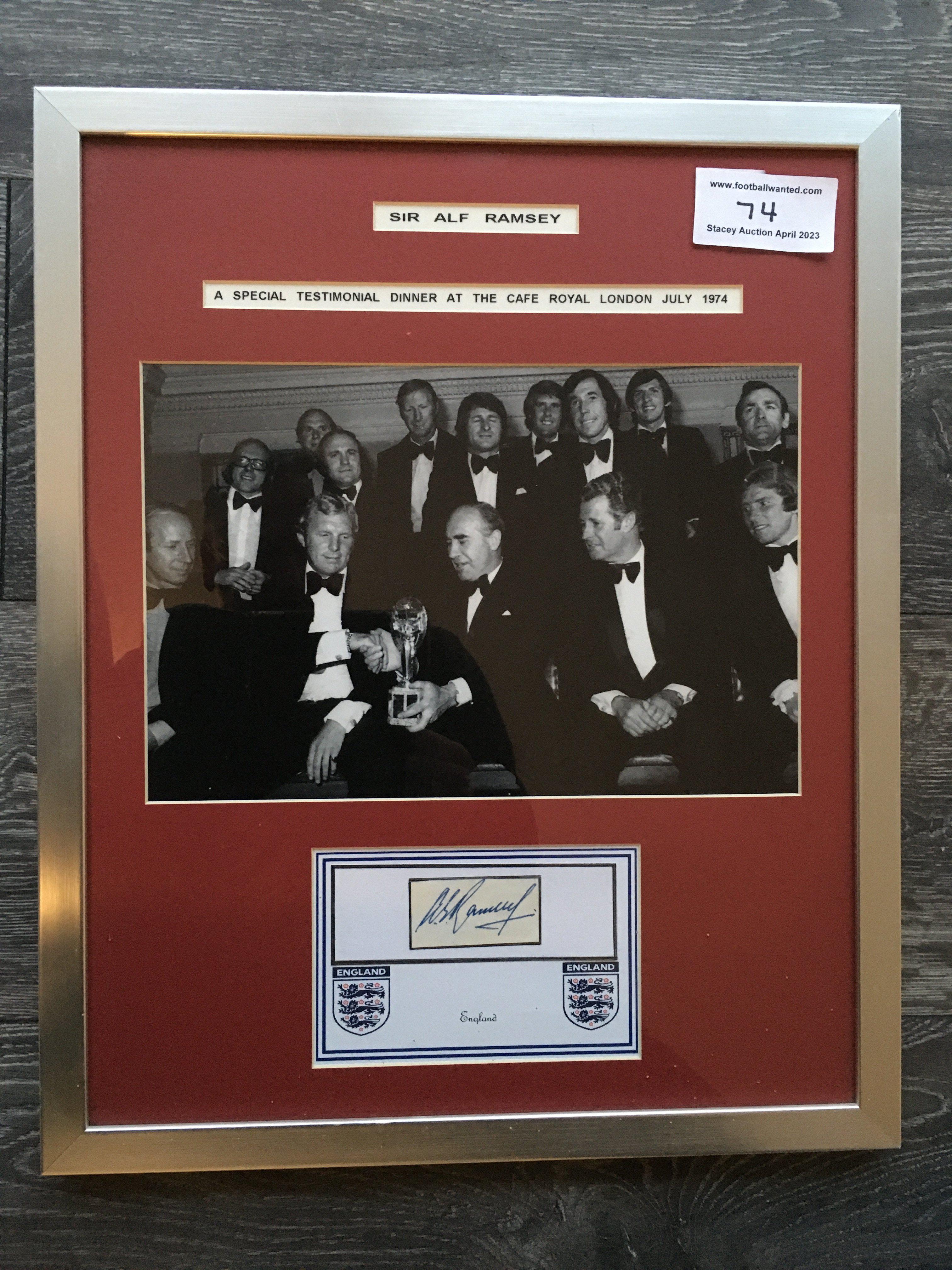 Alf Ramsey Signed 1966 England World Cup Display: Large black and white photo of the team in dinner suits with Alf holding a World Cup. Message reads Sir Alf Ramsey A special testimonial dinner at the Cafe Royal London July 1974. Ramseys autograph is attached to a white card in this attractive display. Red mount and silver frame measuring 15 x 19 inches.