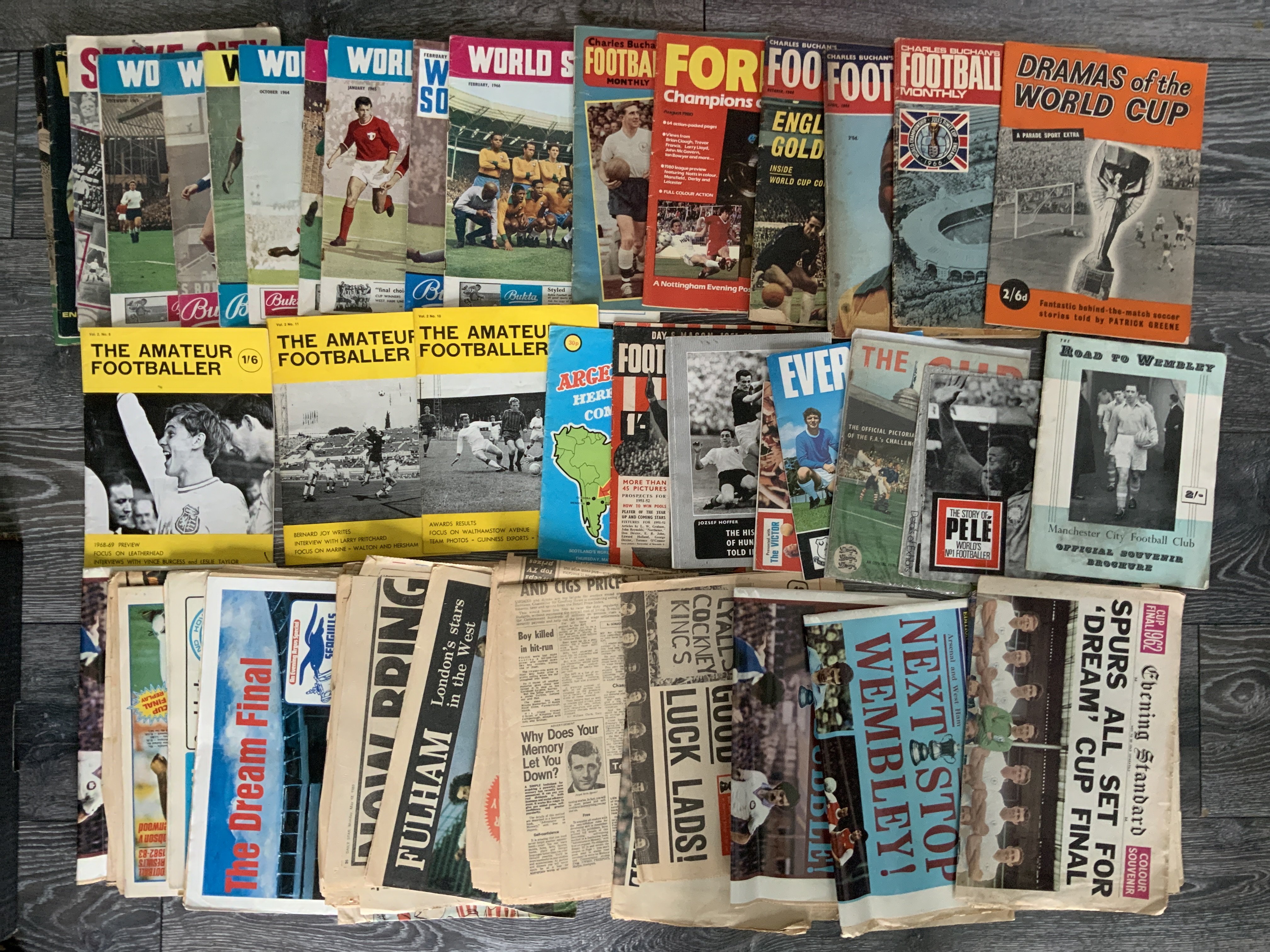 Football Newspapers + Magazines: FA Cup final newspapers and supplements from 1962 onwards with good London Club coverage. C/W a collection of magazines often relating to big matches. Includes Road to Wembley Man City 1955, Everton Champions 69/70, Forest Champions of Europe 1980, World Cups and magazines such as the Amateur Footballer, World Soccer and Charles Buchan.