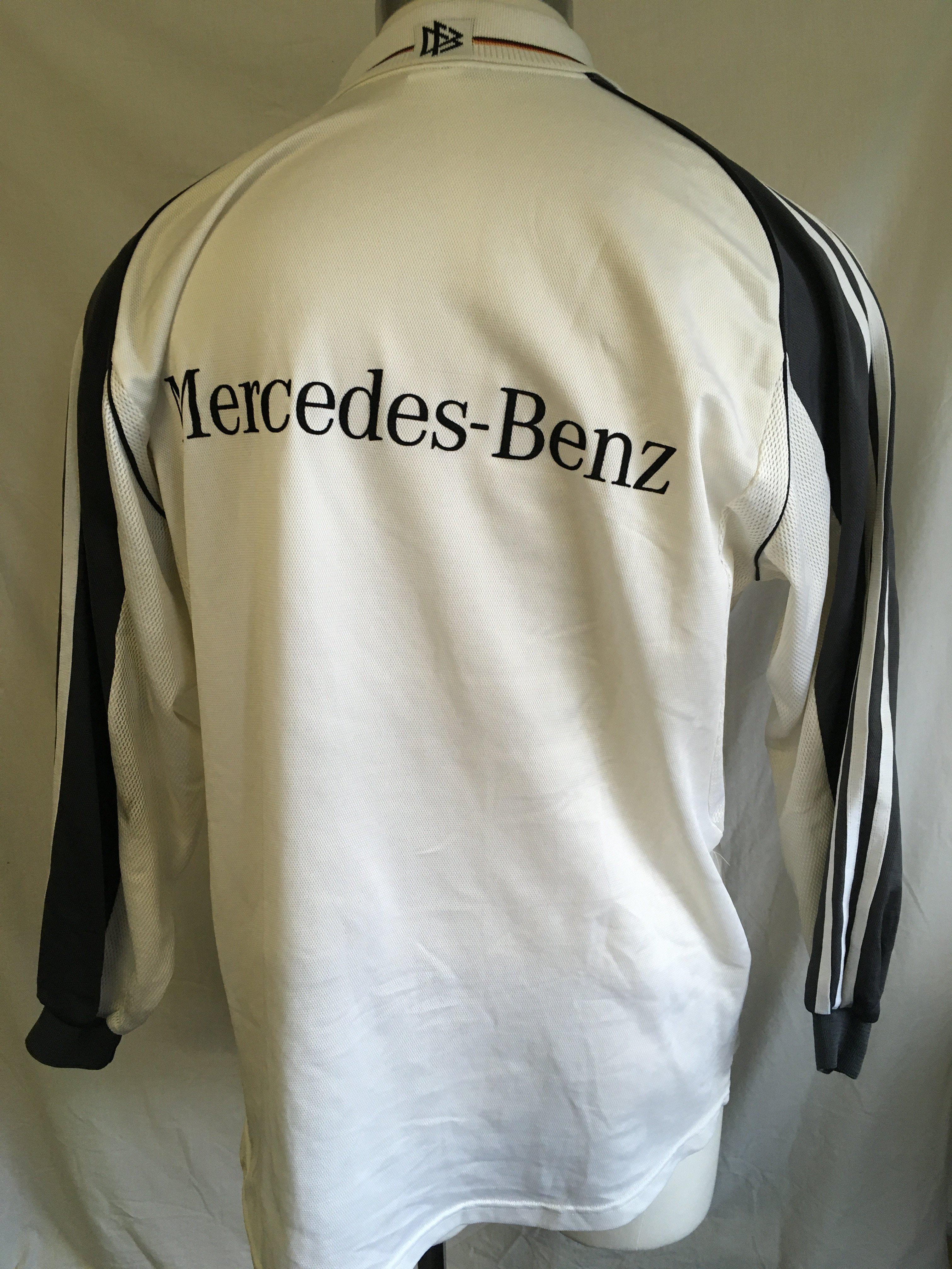 Hamann Germany Signed 2000 Football Shirt: Given to vendor directly by his friend Hamann. Could be a training top as has Mercedes logo to one breast and the usual Adidas logo has moved to the middle with German badge and 3 coloured stars to other breast. Signed clearly without dedication to front by the last goalscorer at Wembley. Slight stain.