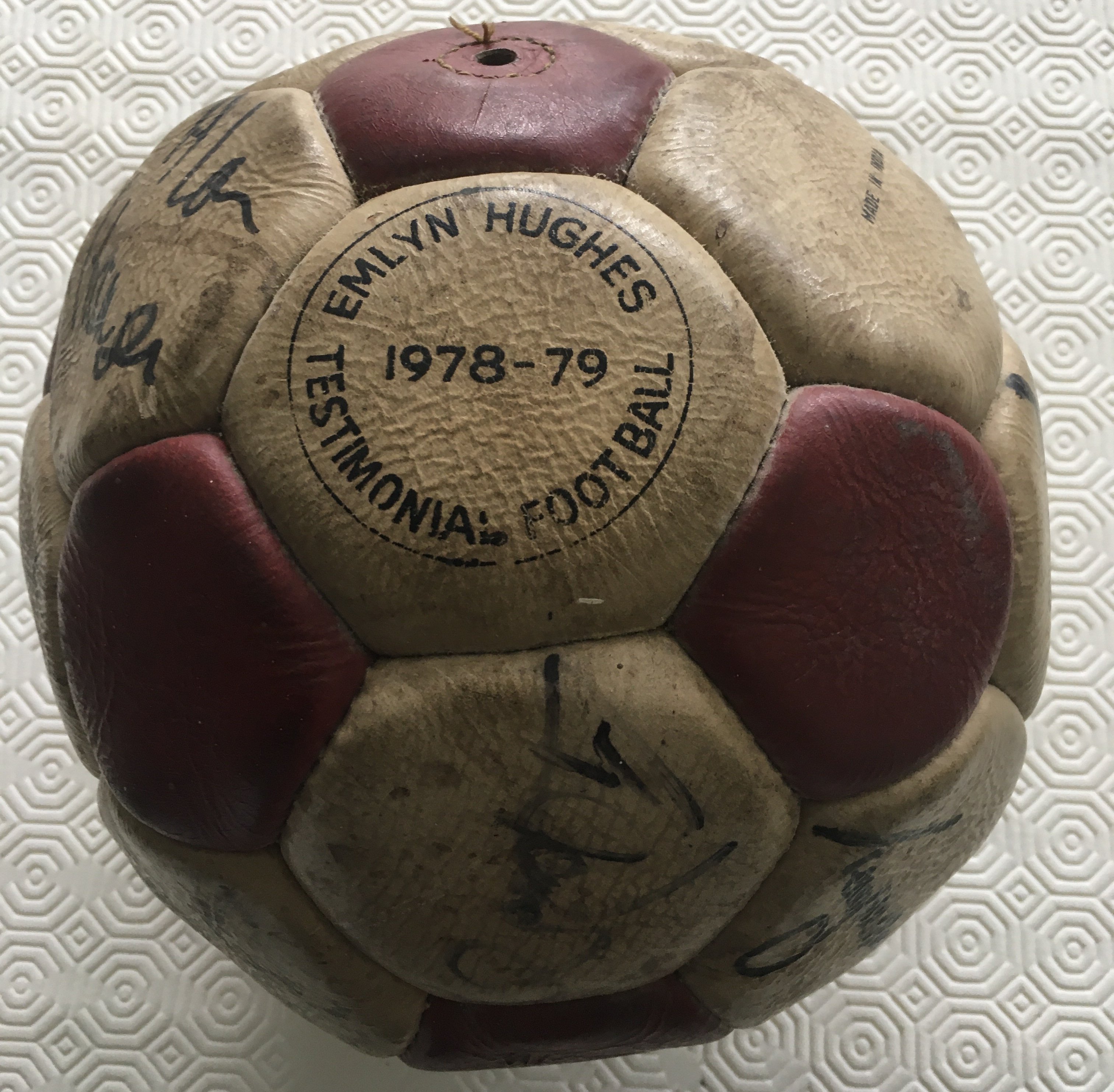 Liverpool Squad Signed 78/79 Testimonial Football: Red and white panelled Sondico football with the words Emlyn Hughes Testimonial Football 1978-79 printed. 16 autographs hand signed in black marker by Hughes, McDermott, Smith, Sheedy, Thompson, Johnson, Neal, Heighway, Fairclough, Clemence, Jones, Case, Ogrizovic, Hansen, Dalglish and one other. Autographs clear even though white panels have aged making it look slightly dirty. Superb rare chance to obtain genuine autographs of the squad that had just won the European Cup. Ball not believed to been used in the Hughes testimonial but more likely in raffles etc to add to the testimonial fund.