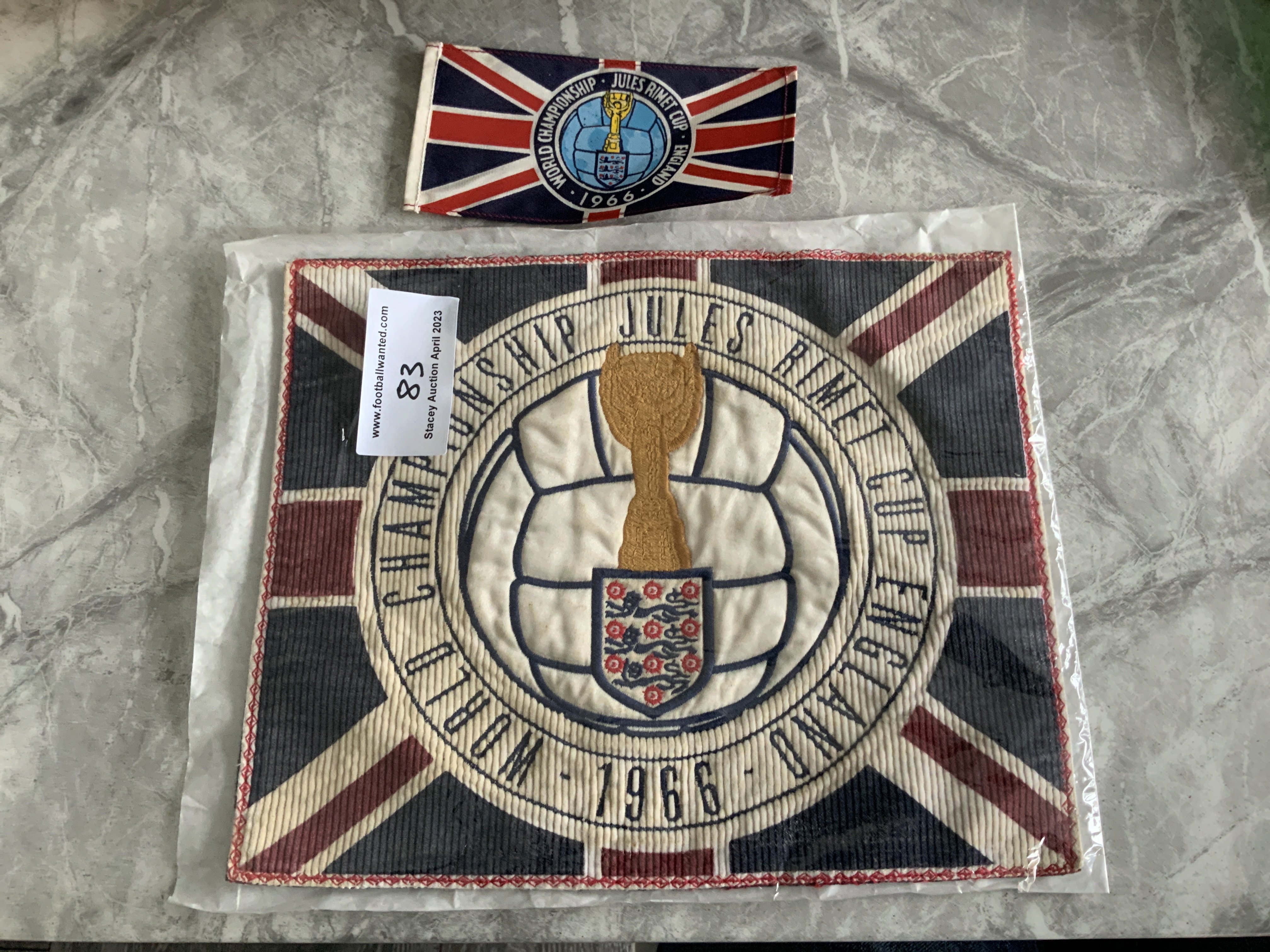 1966 World Cup Top Table Dinner Place Setting: Incredibly rare felt place setting for World Cup dinner with World Cup logo around a Union Jack. C/W small table flag that was on every table at this unique event. (2)