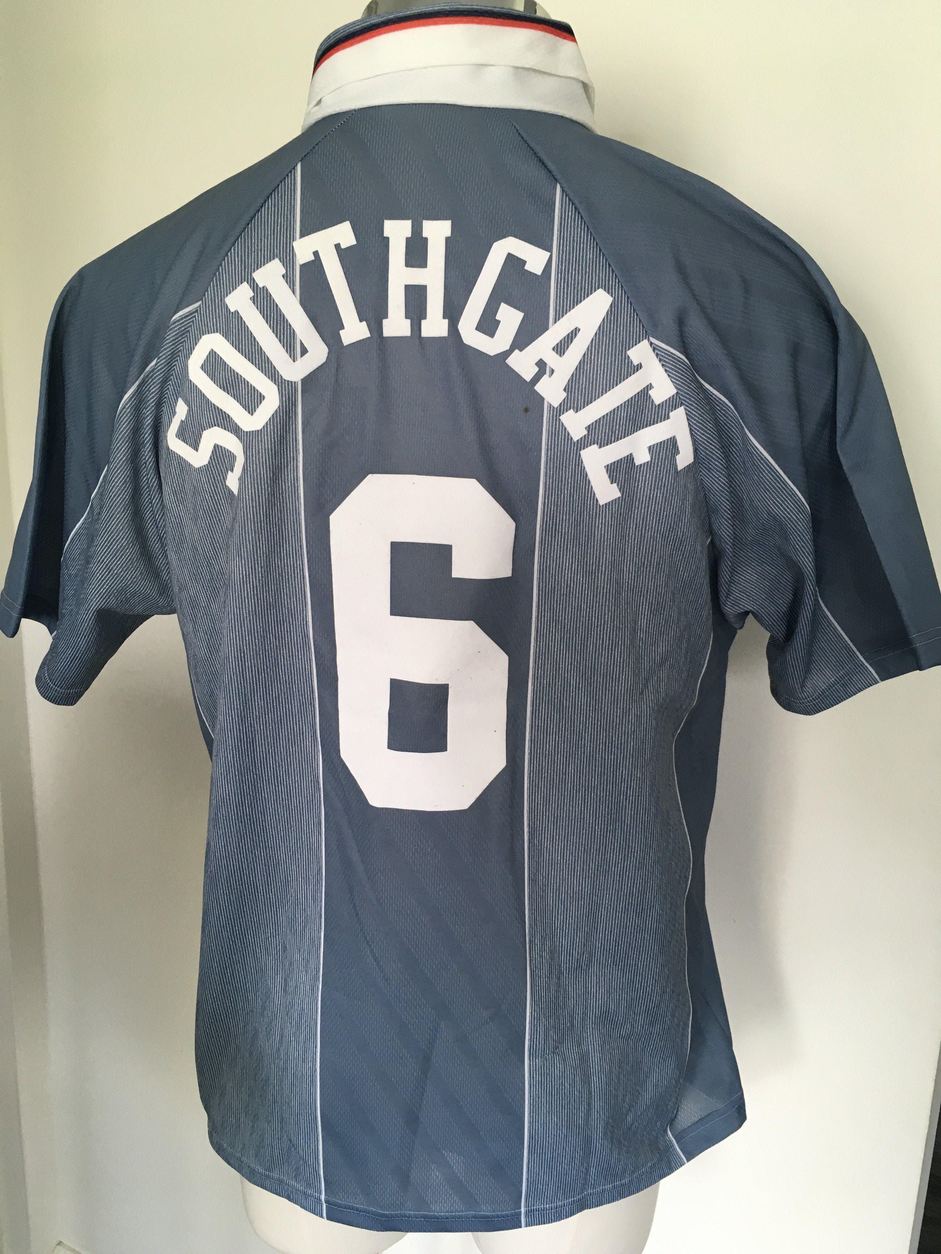 Gareth Southgate Original England 1996 Signed Shirt: Grey number 6 with Southgate to rear the same as the one he famously missed a penalty in during Euro 96. Number 6 to front signed lightly to front and dedicated to George. Whilst not considered a match shirt it was certainly made in 1996 by Umbro.