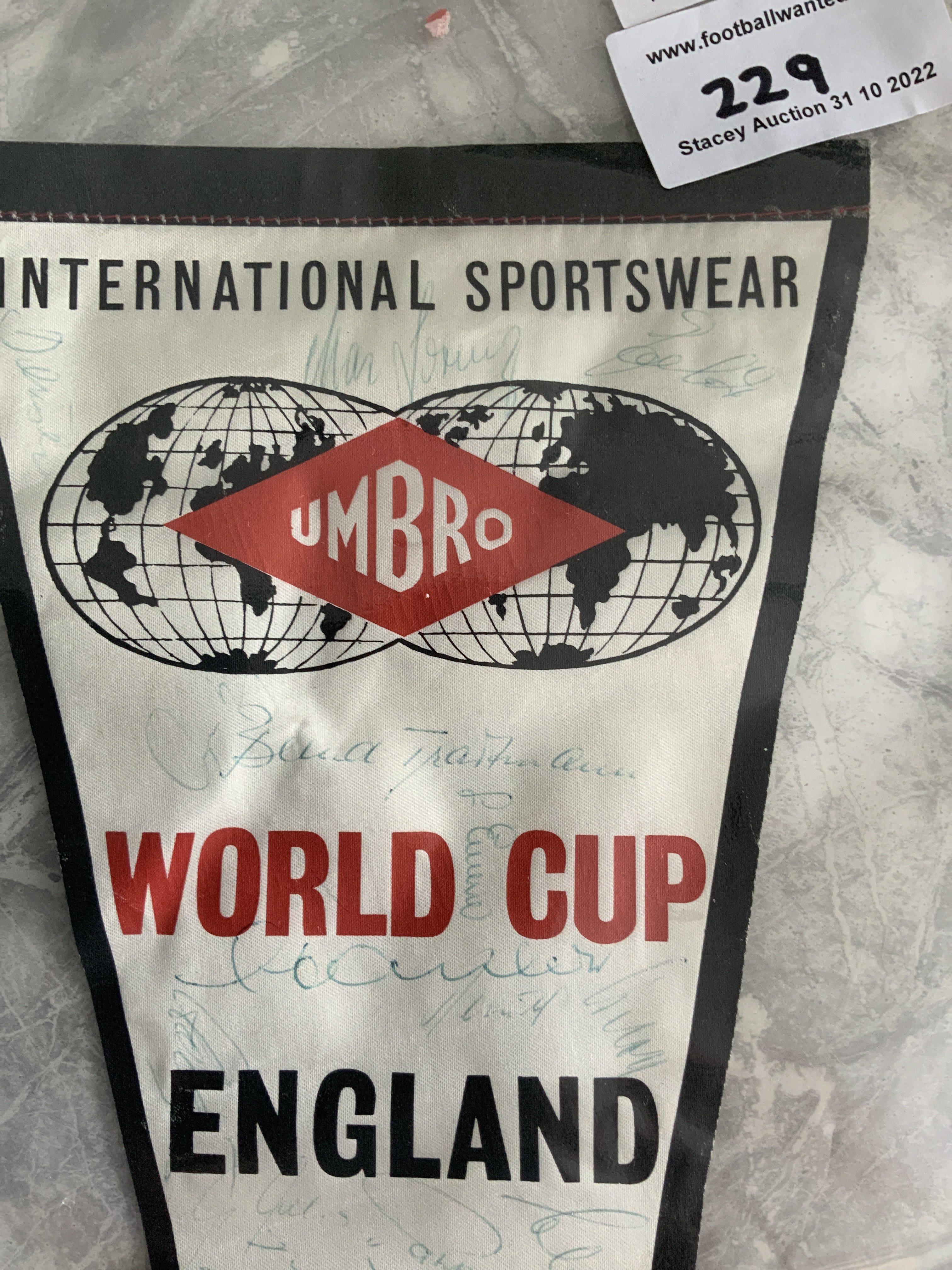 1966 World Cup Signed Germany Squad Pennant: Large Umbro pennant which states World Cup 1966 England as Umbro supplied the kit for the England team. Signed in the day by 18 in blue biro by the German team and Bert Trautmann who travelled with the Germans.