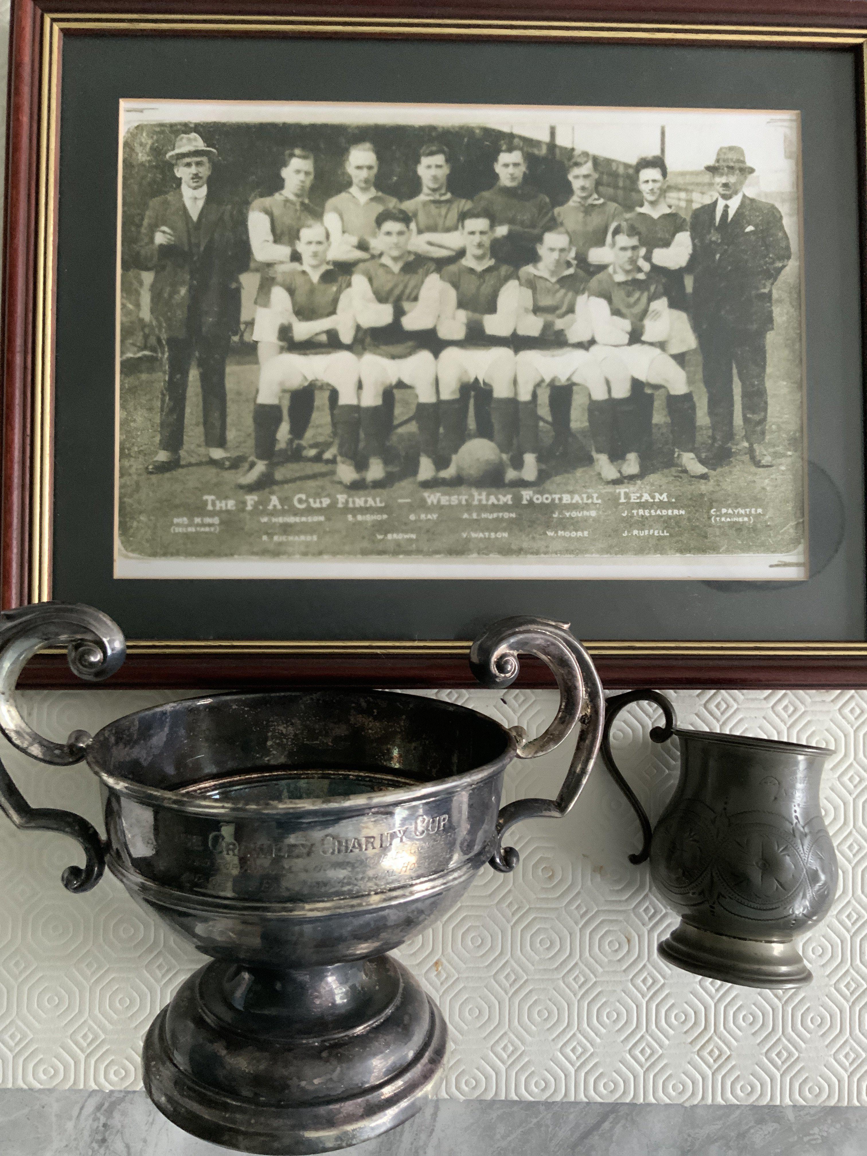 Billy Moore West Ham Football Cups: Crawley Charity Cup in aid of the East Ham Memorial Hospital, year unknown and very blemished. C/W a much smaller tankard engraved to WGB Moore from Mr + Mrs Cowen. Not sure if these were from his playing days or coaching so a span of 40 years 1920 to 1960 a possibility. Framed replica photo of the 1923 Cup Final team featuring Moore. These came with his medals that feature at the beginning of the catalogue.