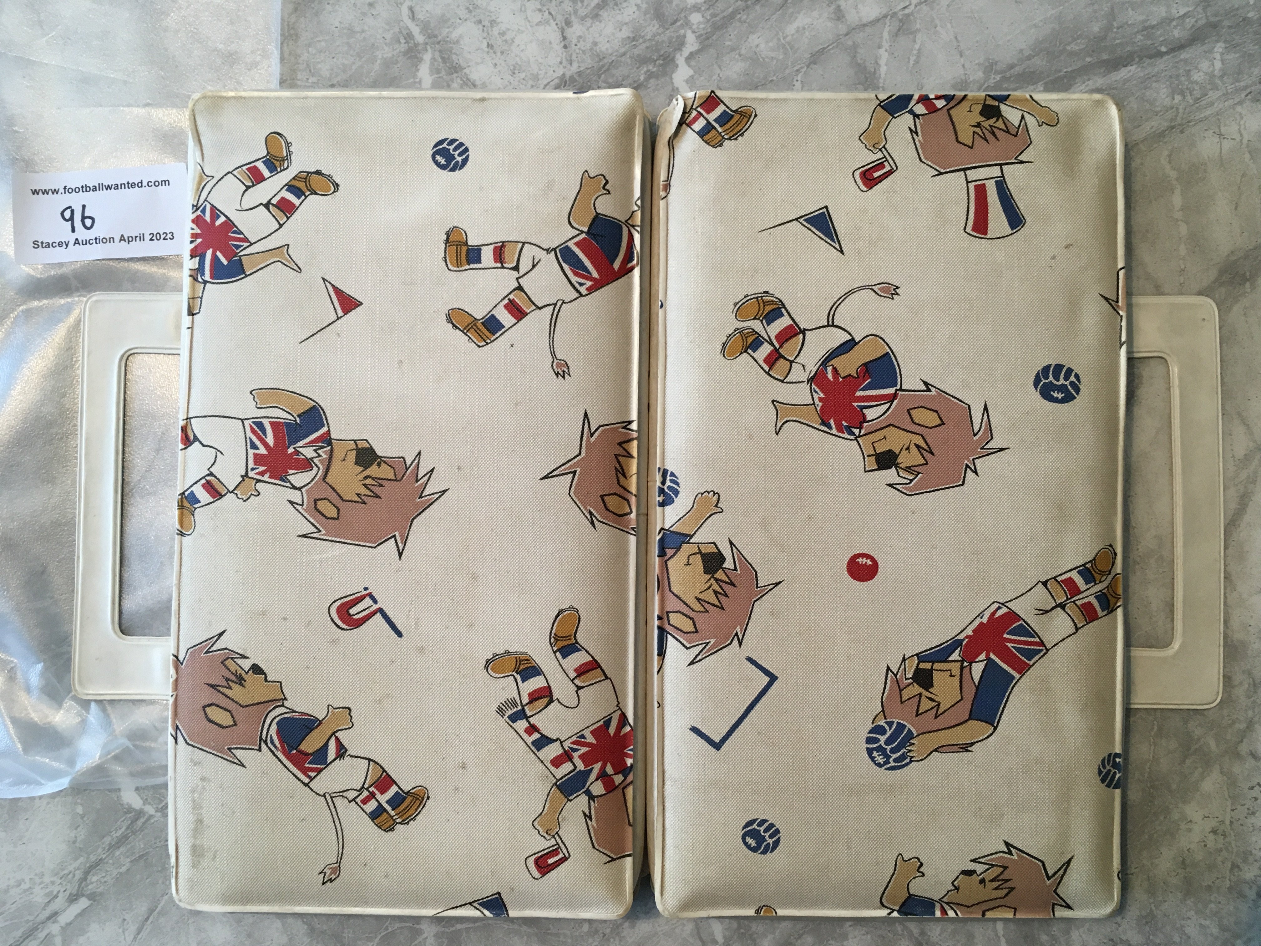 1966 Football World Cup Willie Seat Cover: Superb foldable seat cover to put on your seat for more comfort at the match. Features WC Willie with both carrying handles still intact.