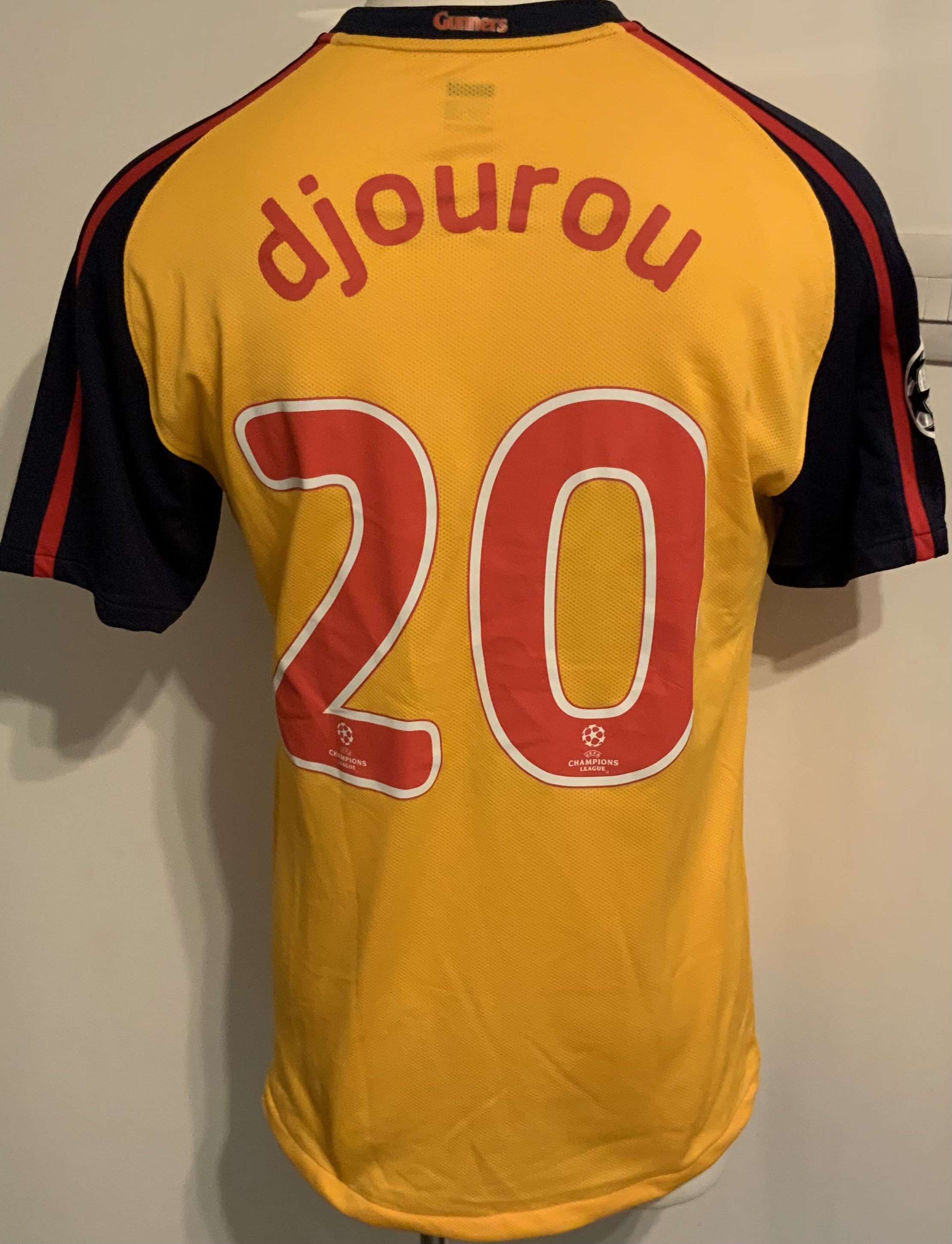 Arsenal 2008 - 2009 Match Worn Football Shirt: Yellow short sleeve with Champions League badging to arms. Number 20 Djourou to rear.