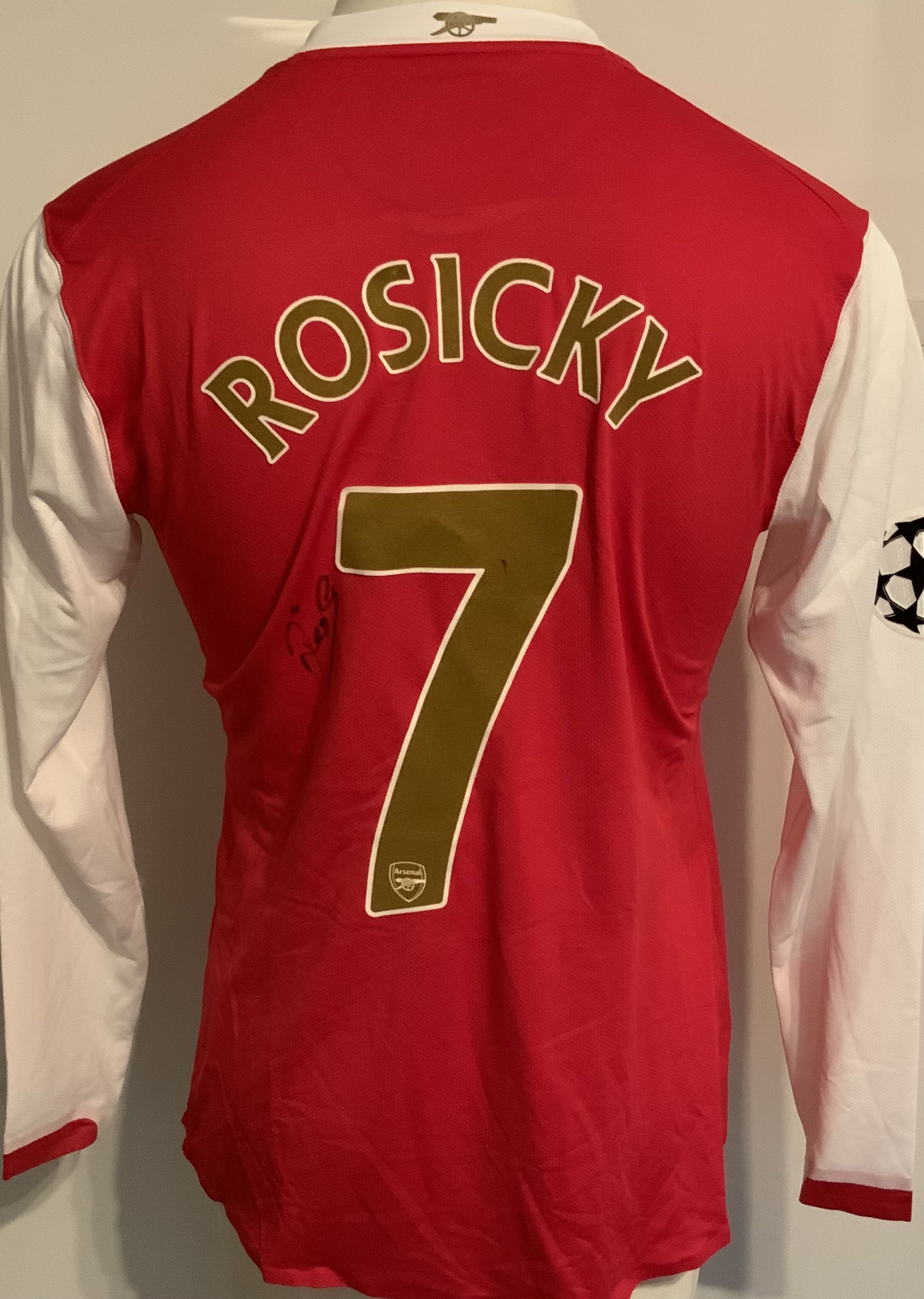 Arsenal 2010 - 2011 Match Issued Football Shirt: Red long sleeve with Champions League badging to arm. Number 7 Rosicky to rear where he has signed.