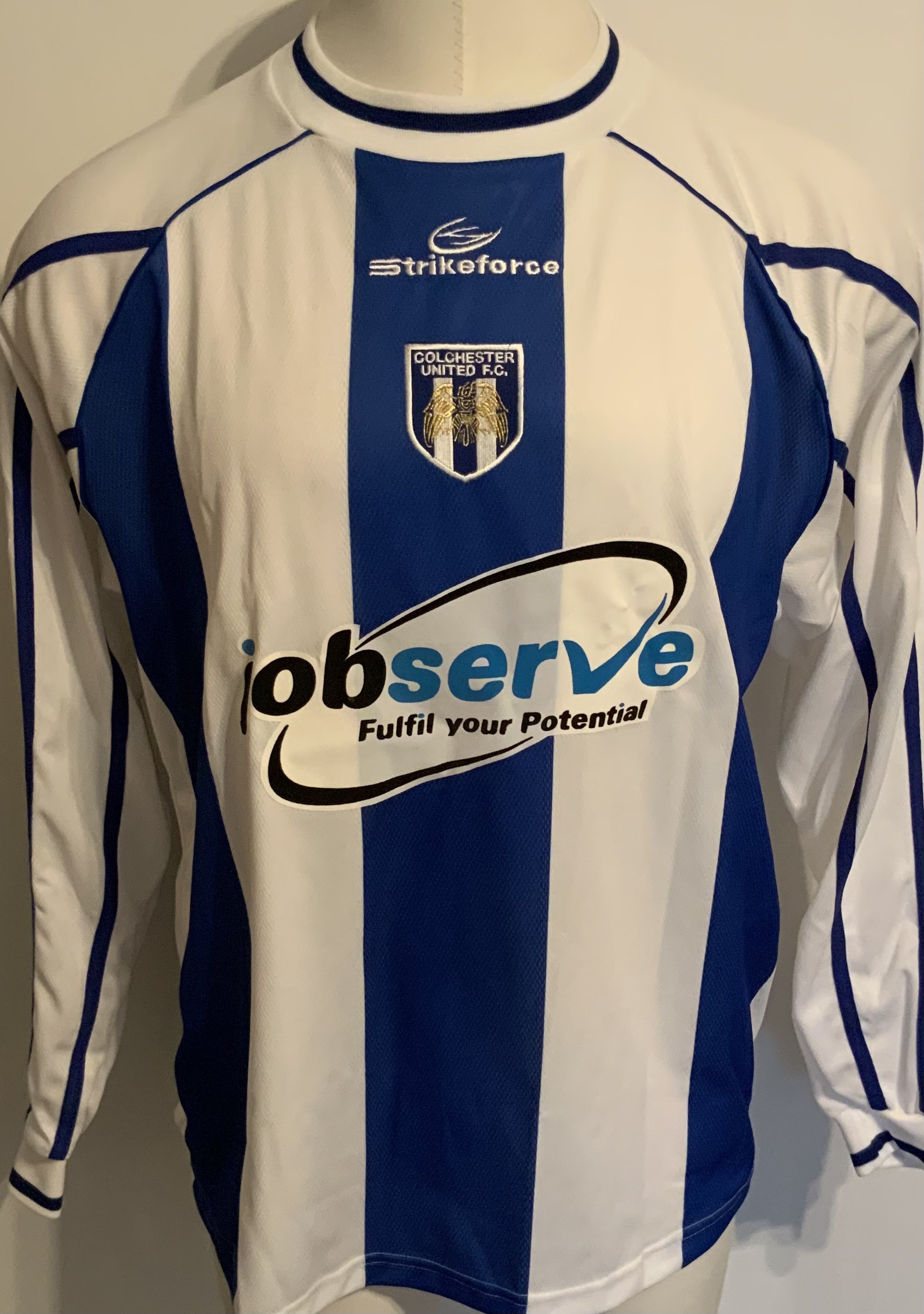 Colchester United 2001 - 2002 Match Worn Football Shirt: Blue long sleeve with Nationwide badging to arms. Number 11 Dozzell to rear.