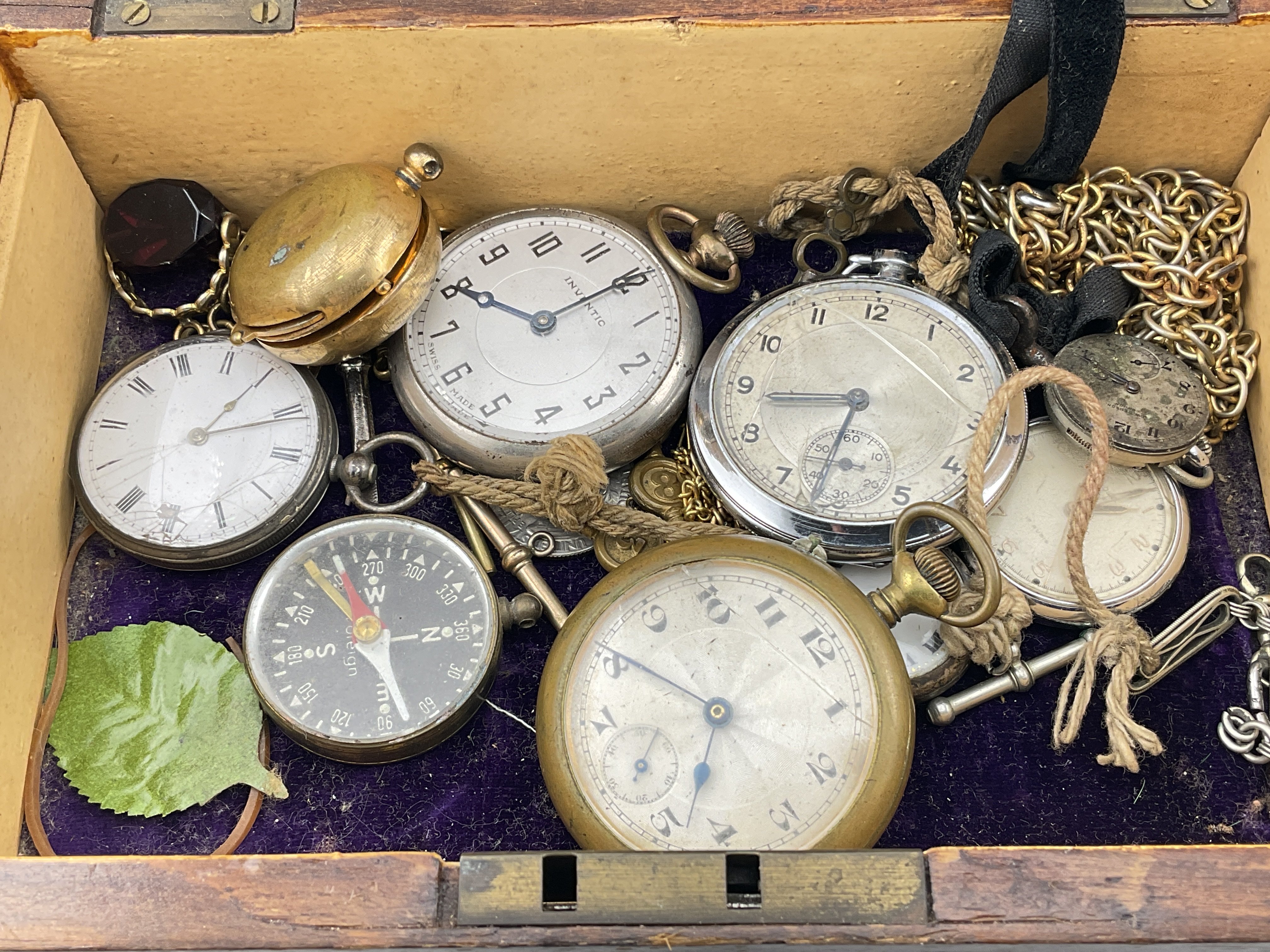 A box of interesting items to include silver watches, compass etc. Postage category B.