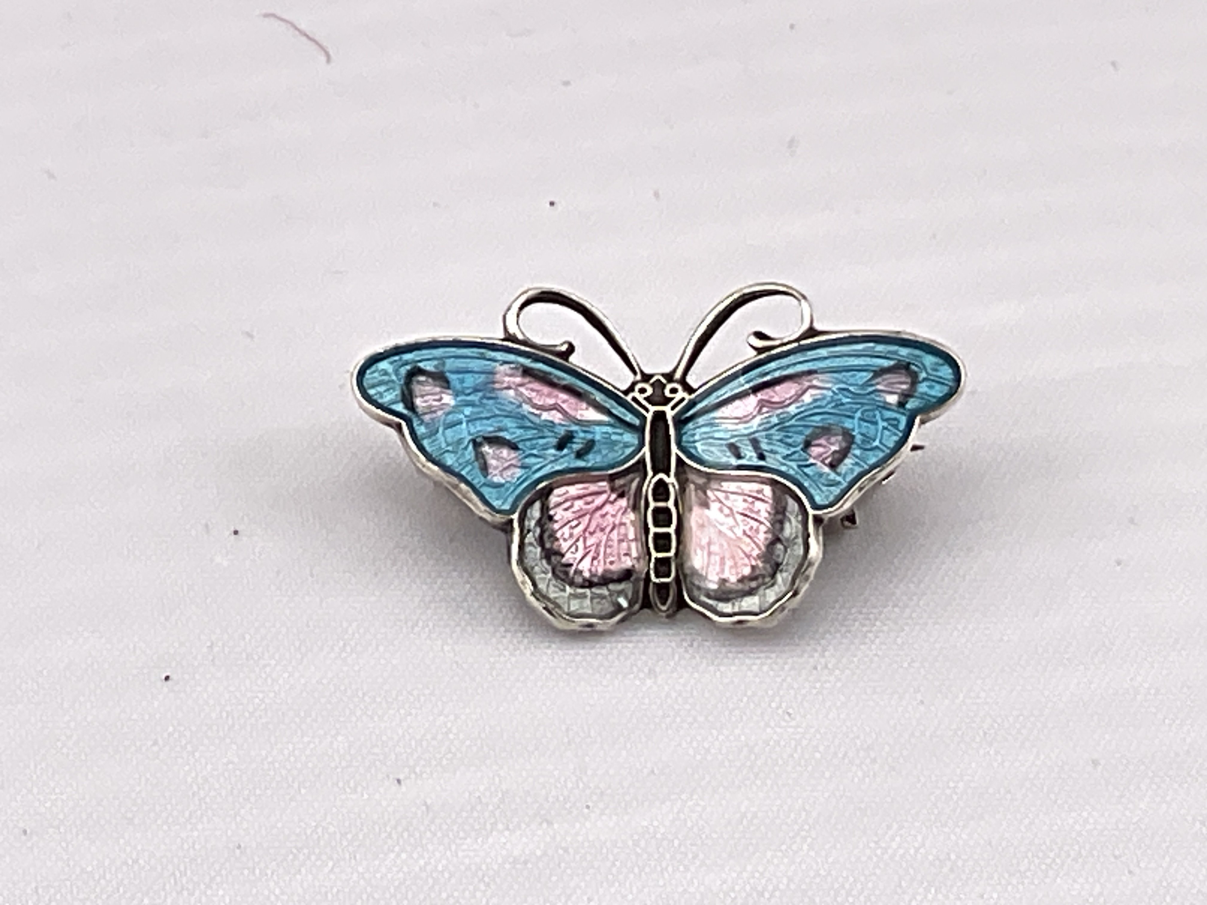A Norwegian silver and enamelled butterfly brooch. Postage category A.