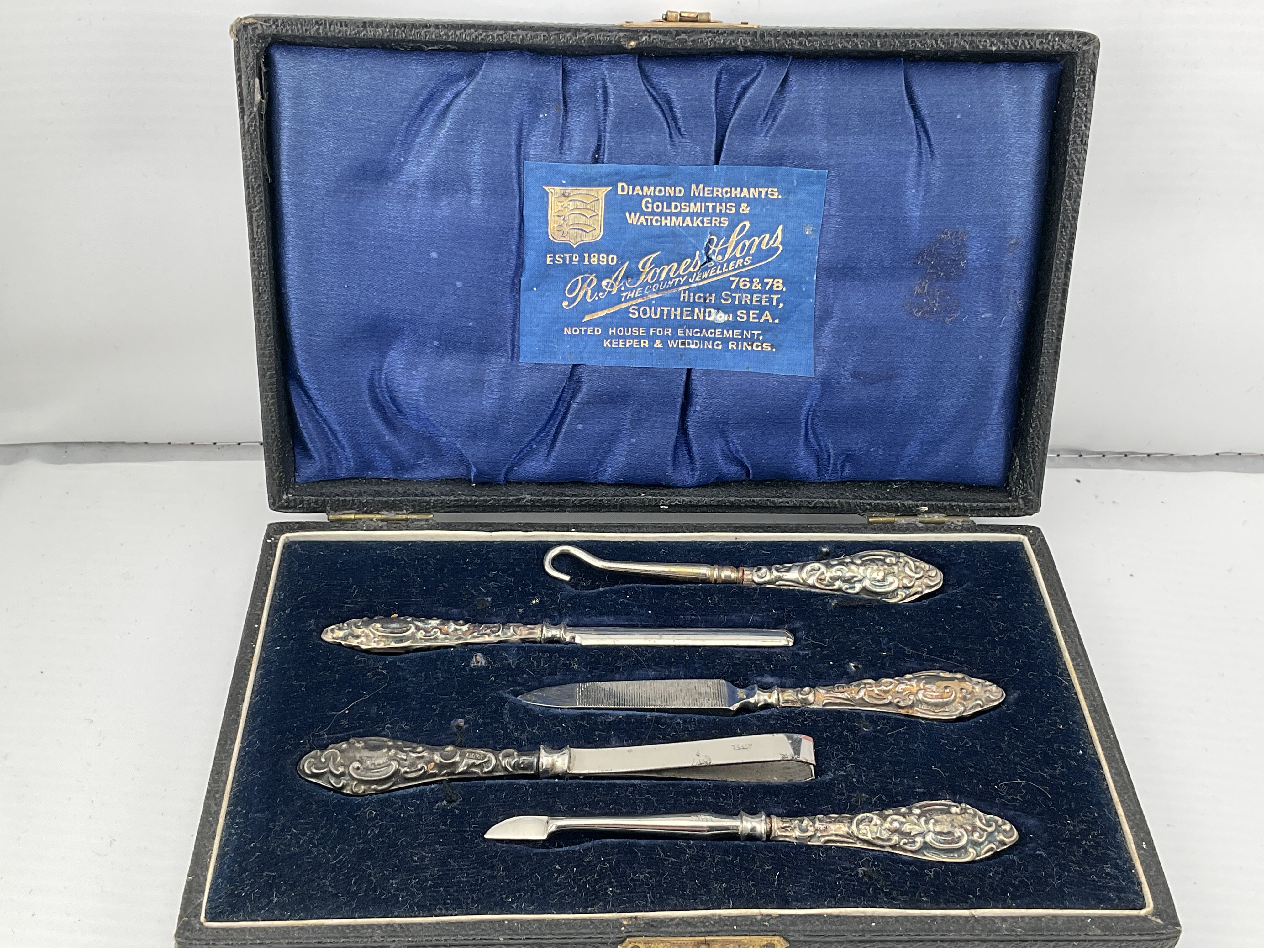A boxed silver manicure set. Postage category B.
