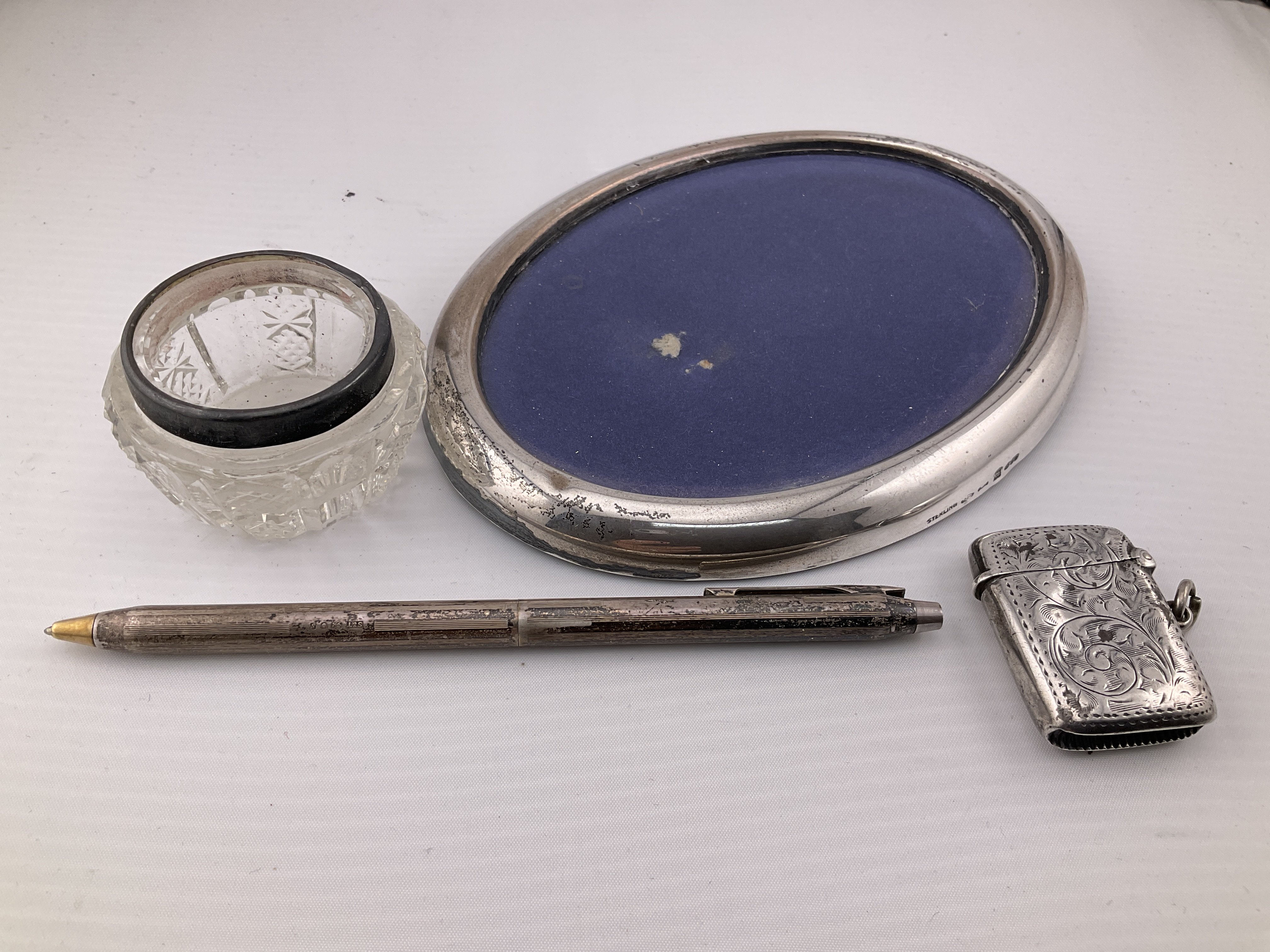 A collection of silver items. Postage category A.