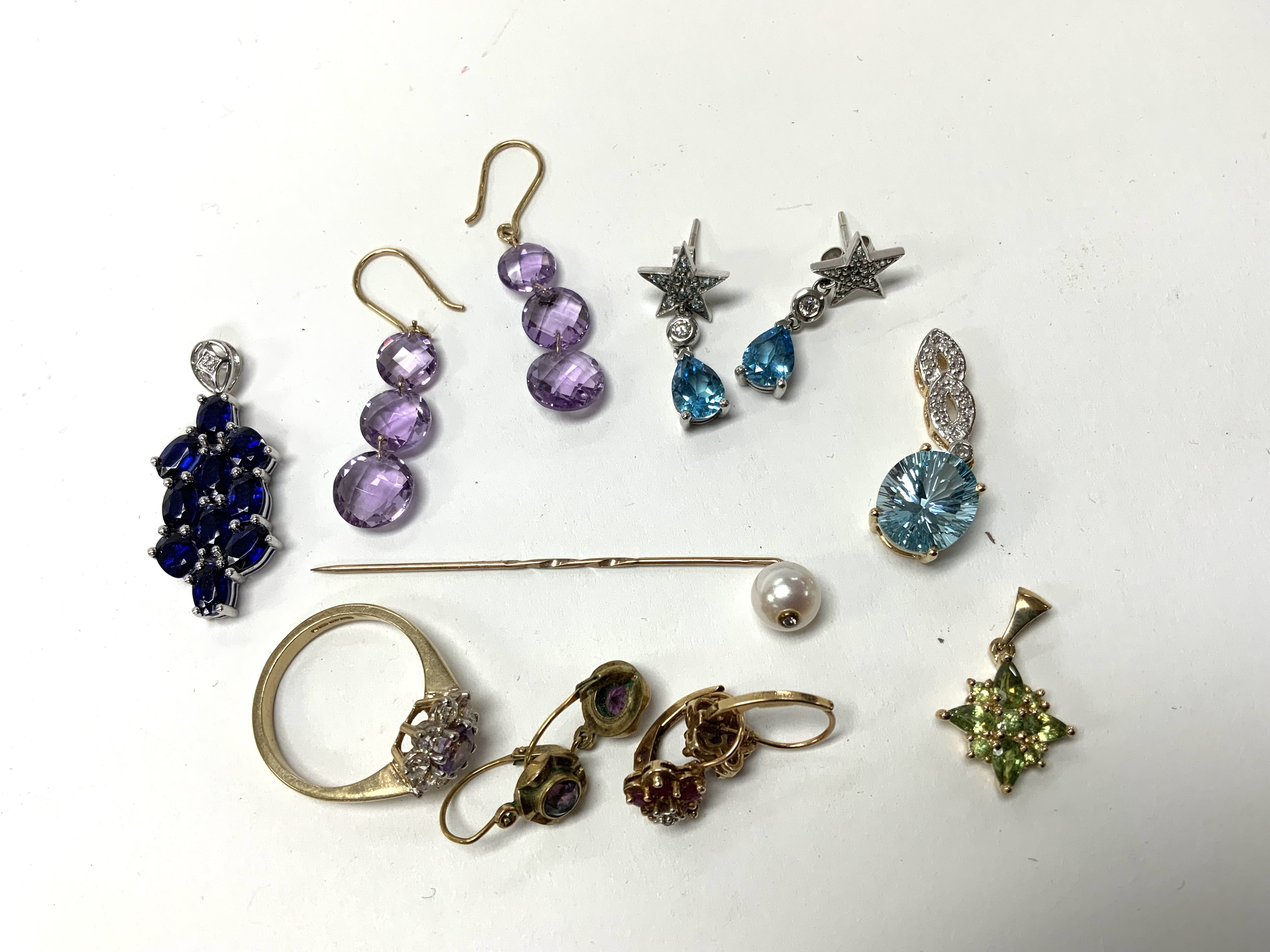 A mixed lot of gold and yellow metal gem set jewellery. (A)