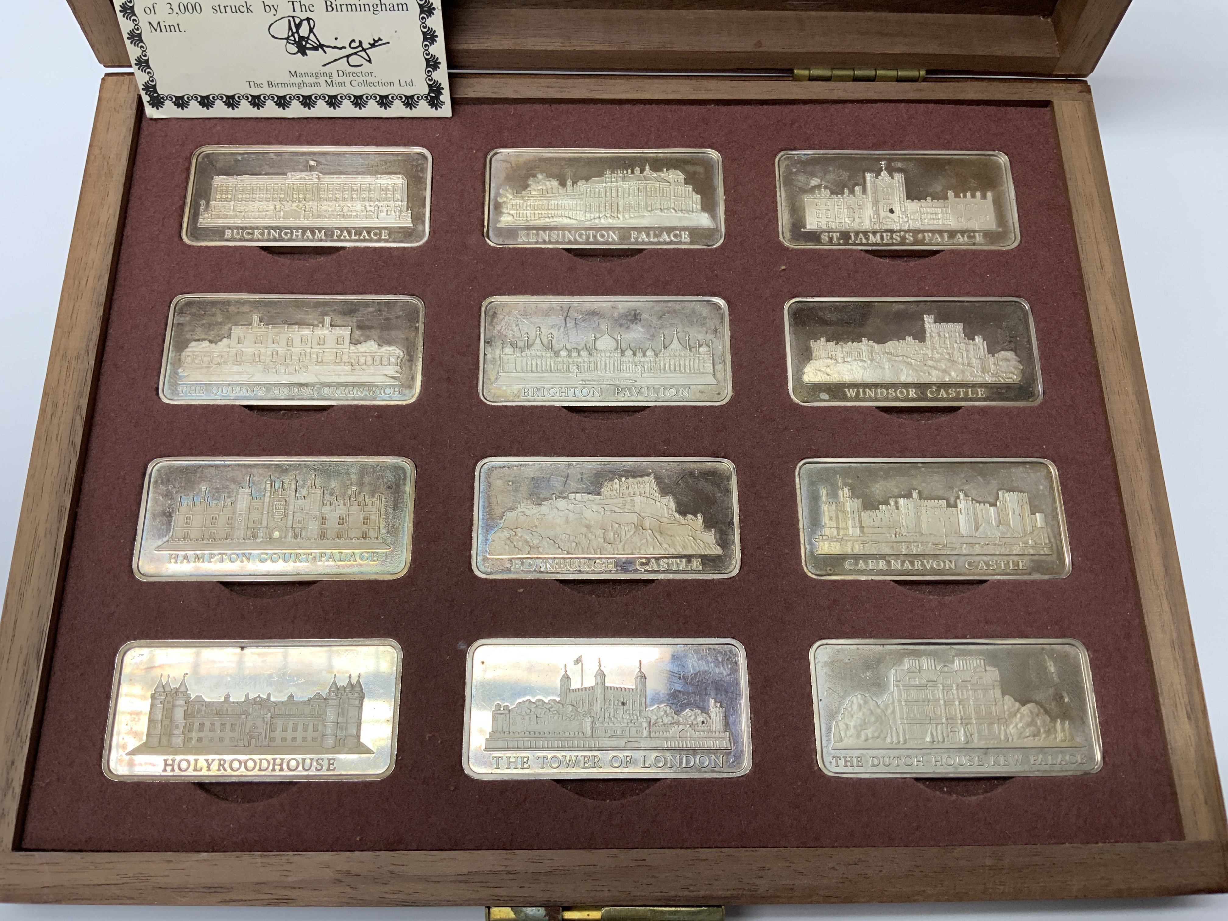 A cased set of 12 hallmarked silver Birmingham mint Royal palace ingots each weighing 31.5g (B)