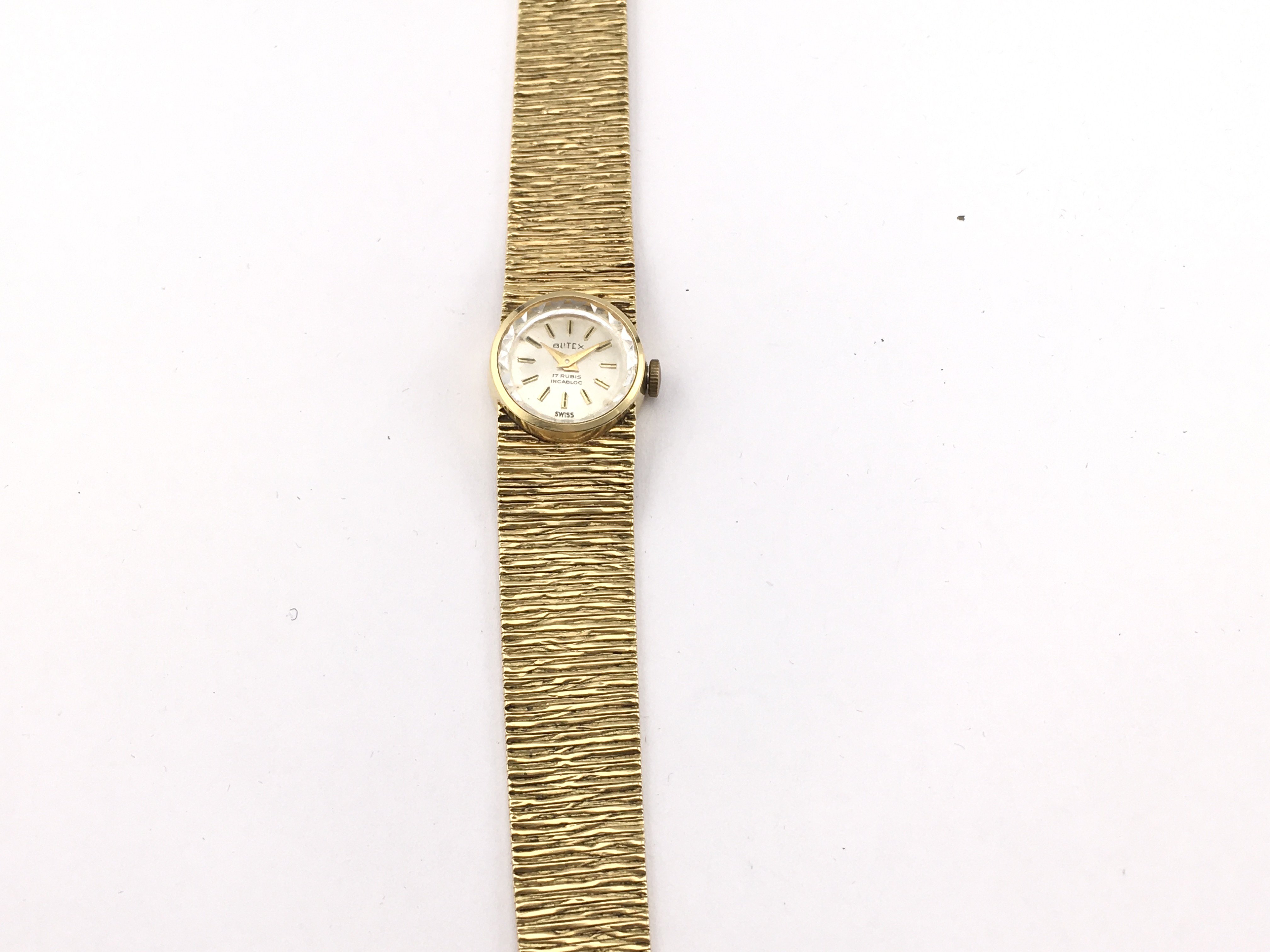 An 18ct gold ladies watch not seen running. 42.05g