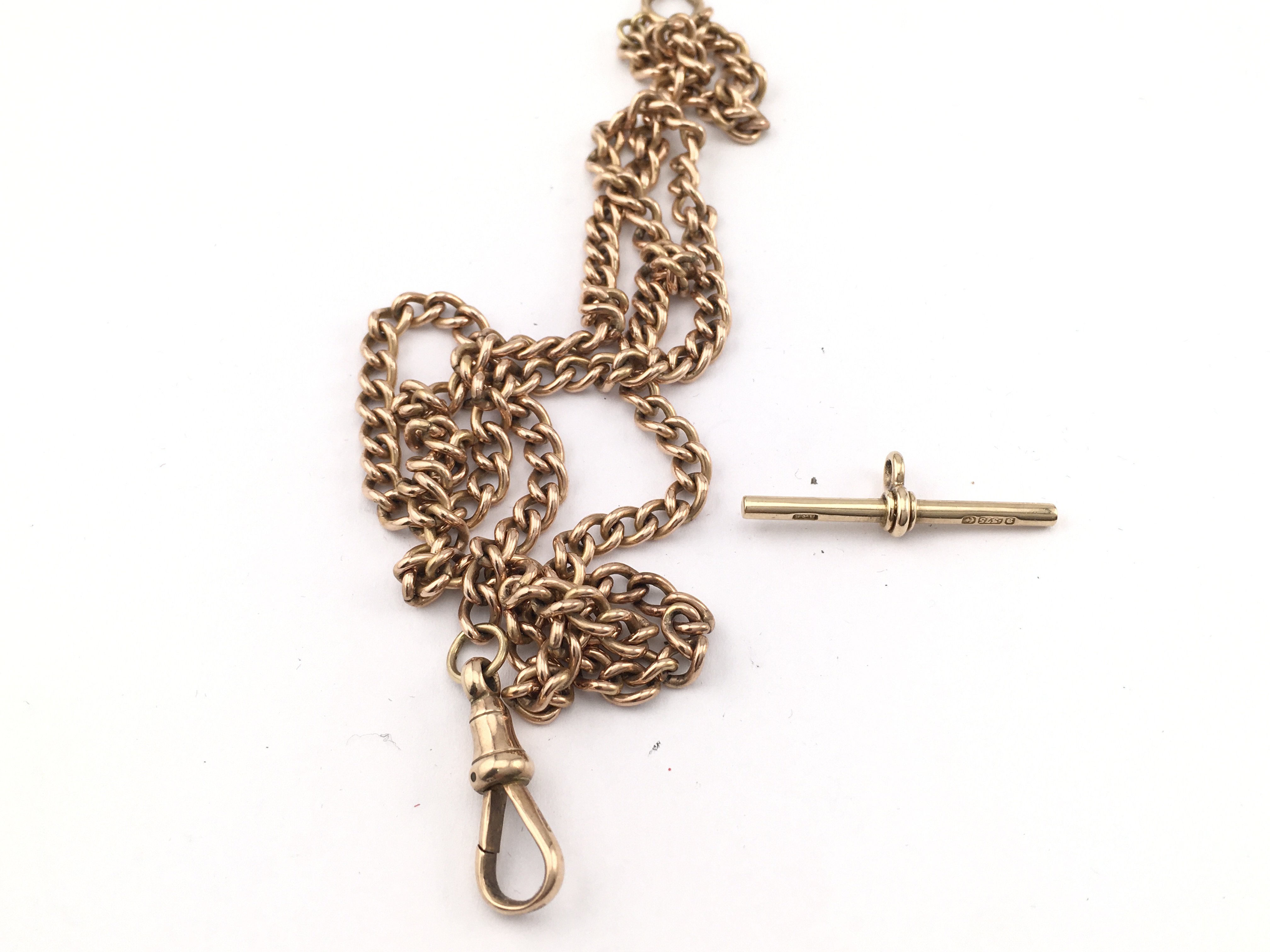 A 14ct gold Albert chain with 9ct t bar and 9ct ends. 36.71g Postage A