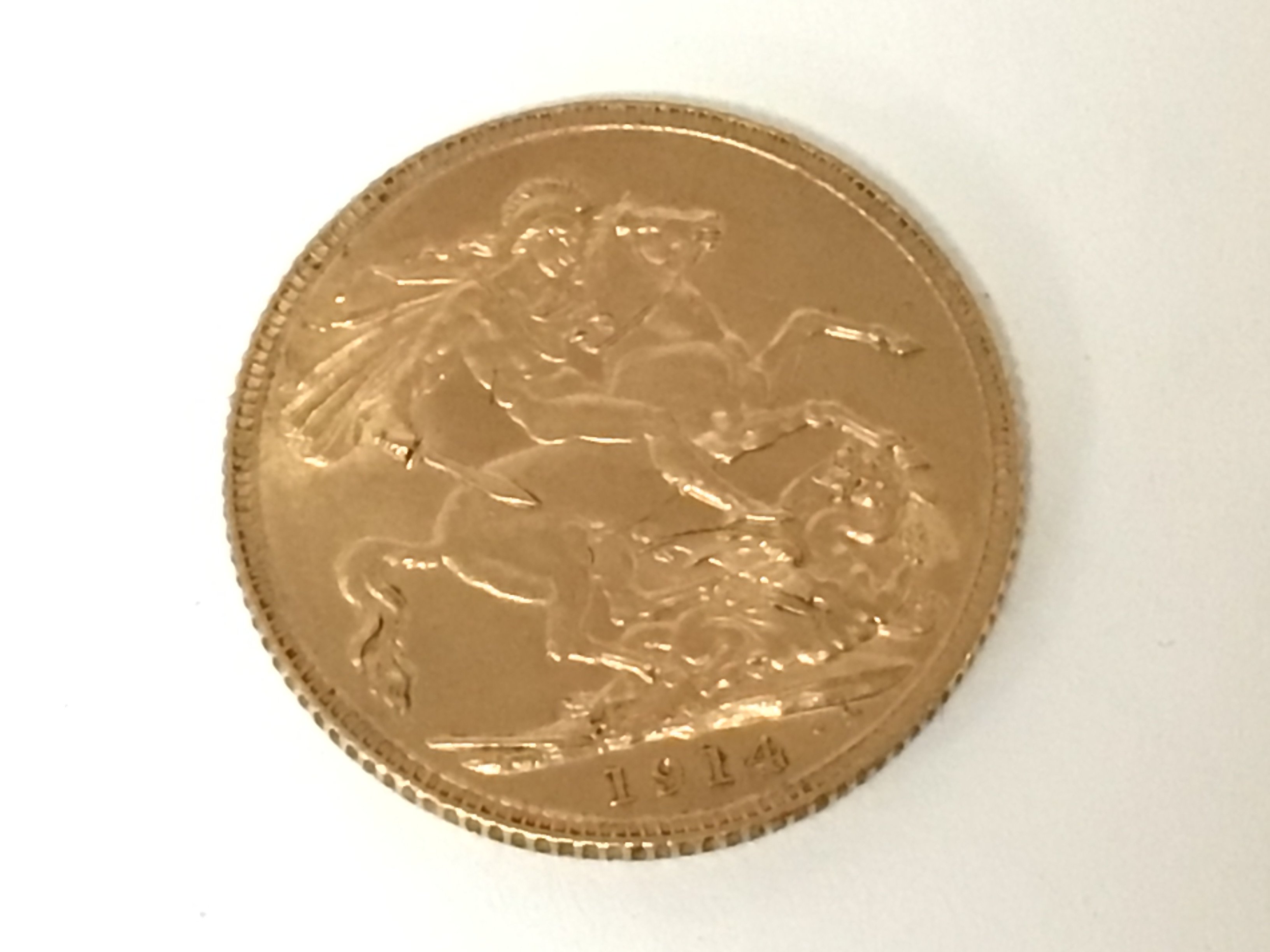 A George V 1914 gold sovereign.