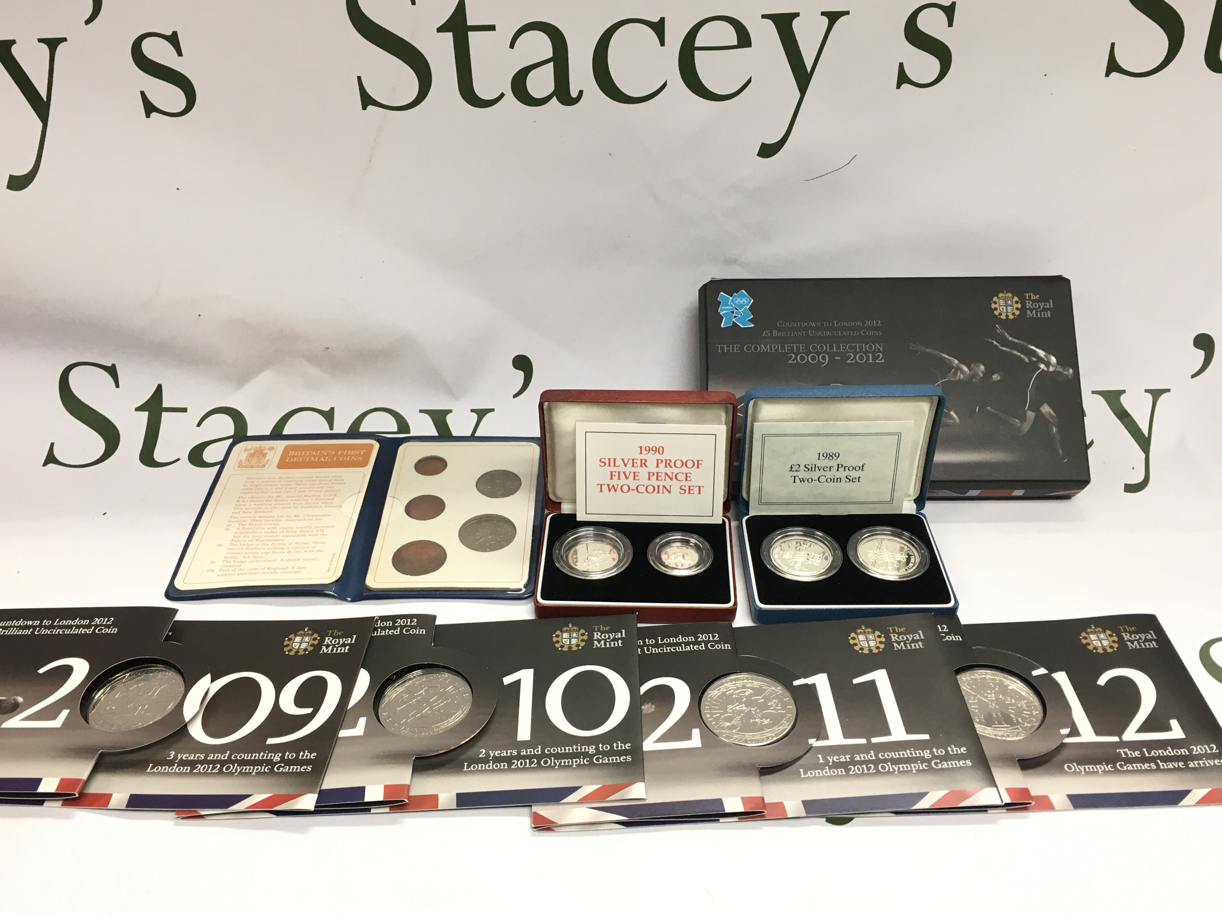 1989 silver proof coin set 1990 silver proof five pence coin set and the 2009 - 2012 countdown to London uncirculated coins. Postage B