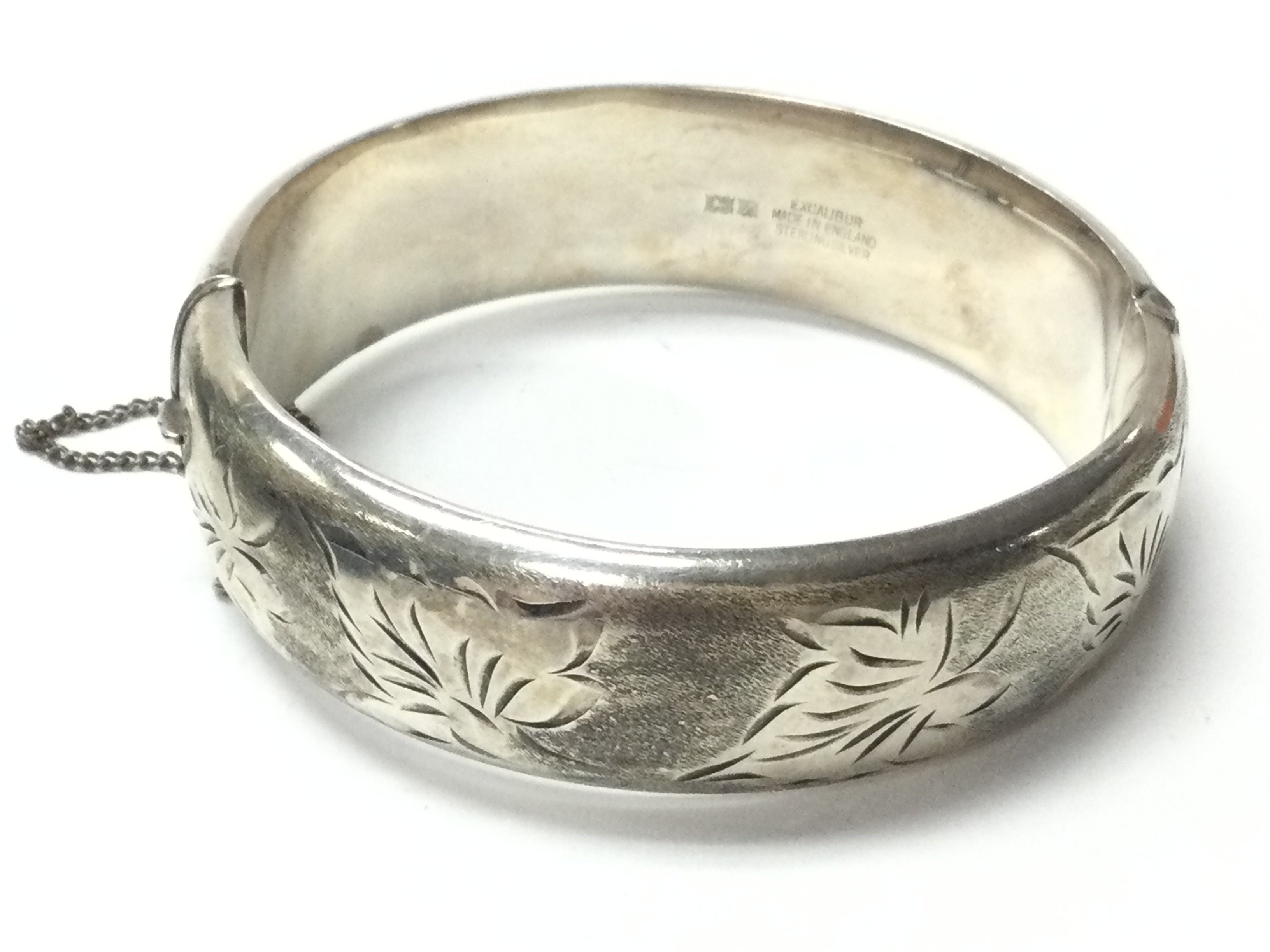 A silver hallmarked bangle , postage category A