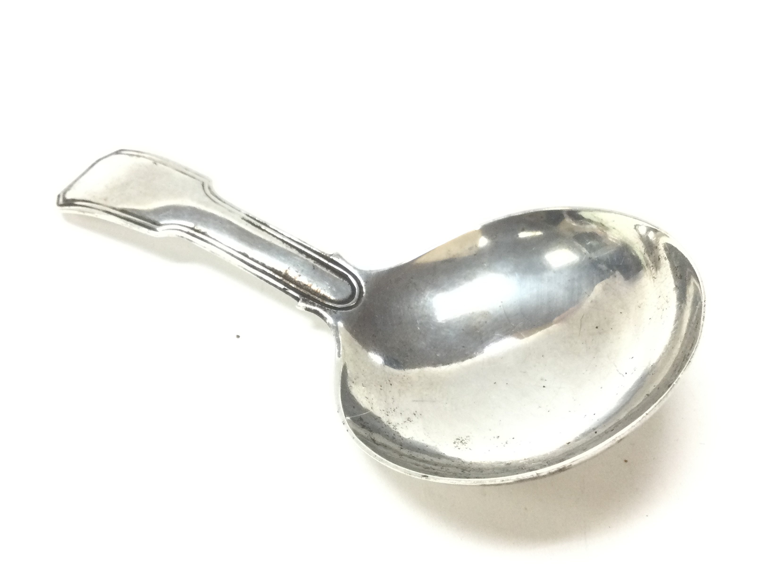 A Georgian silver caddy spoon. Postage category A