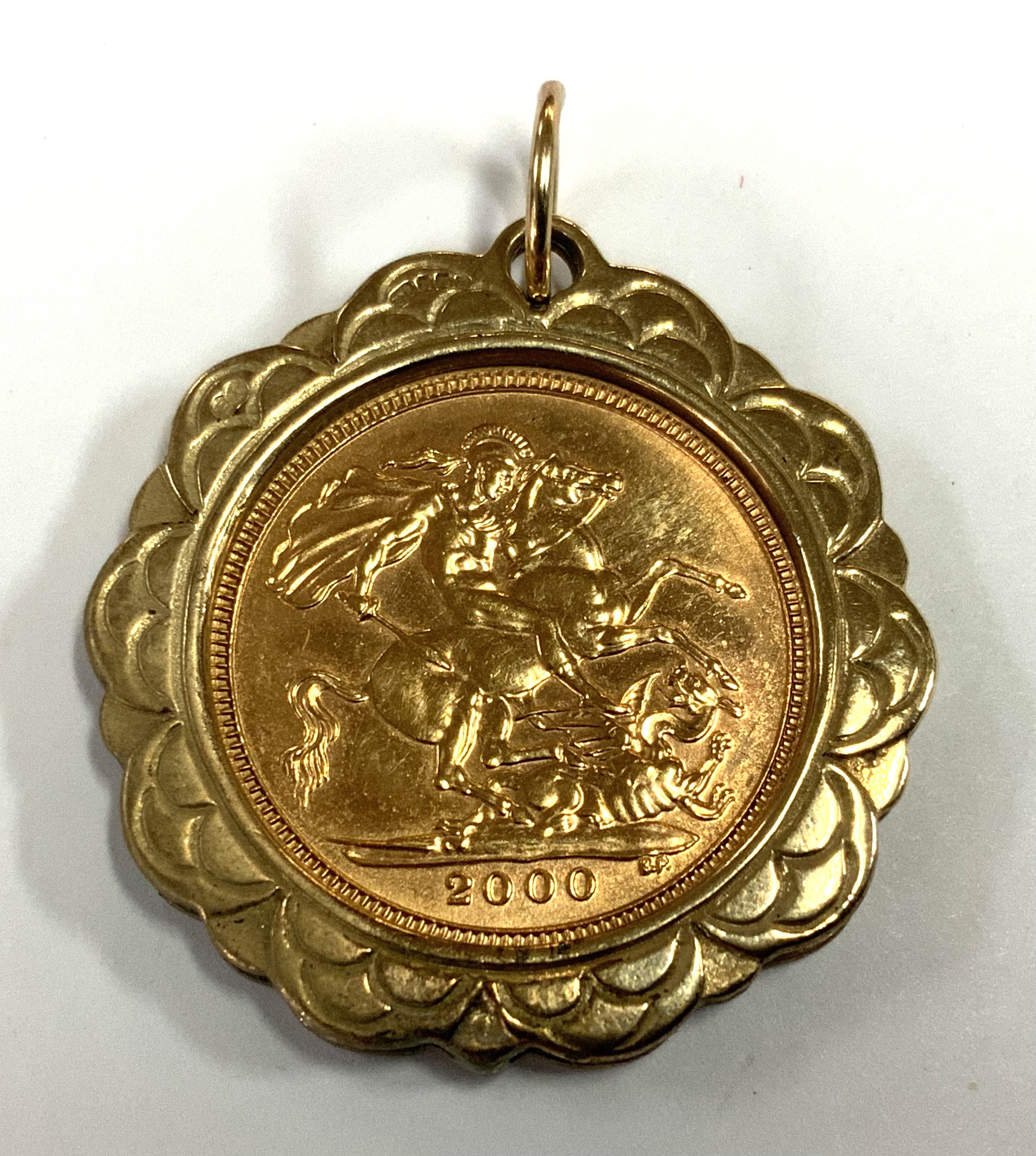 Elizabeth II, 2000 Half Sovereign in a 9ct gold mount, 8.23g (A)