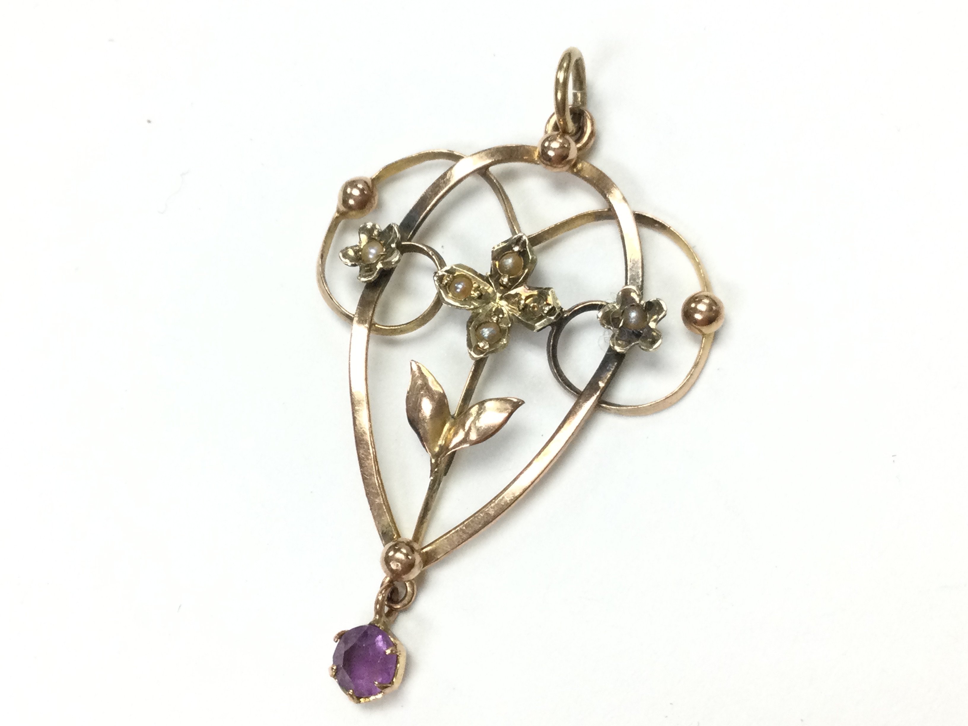 A 9ct Art Nouveau pendant , total weight 1.3g .postage category A