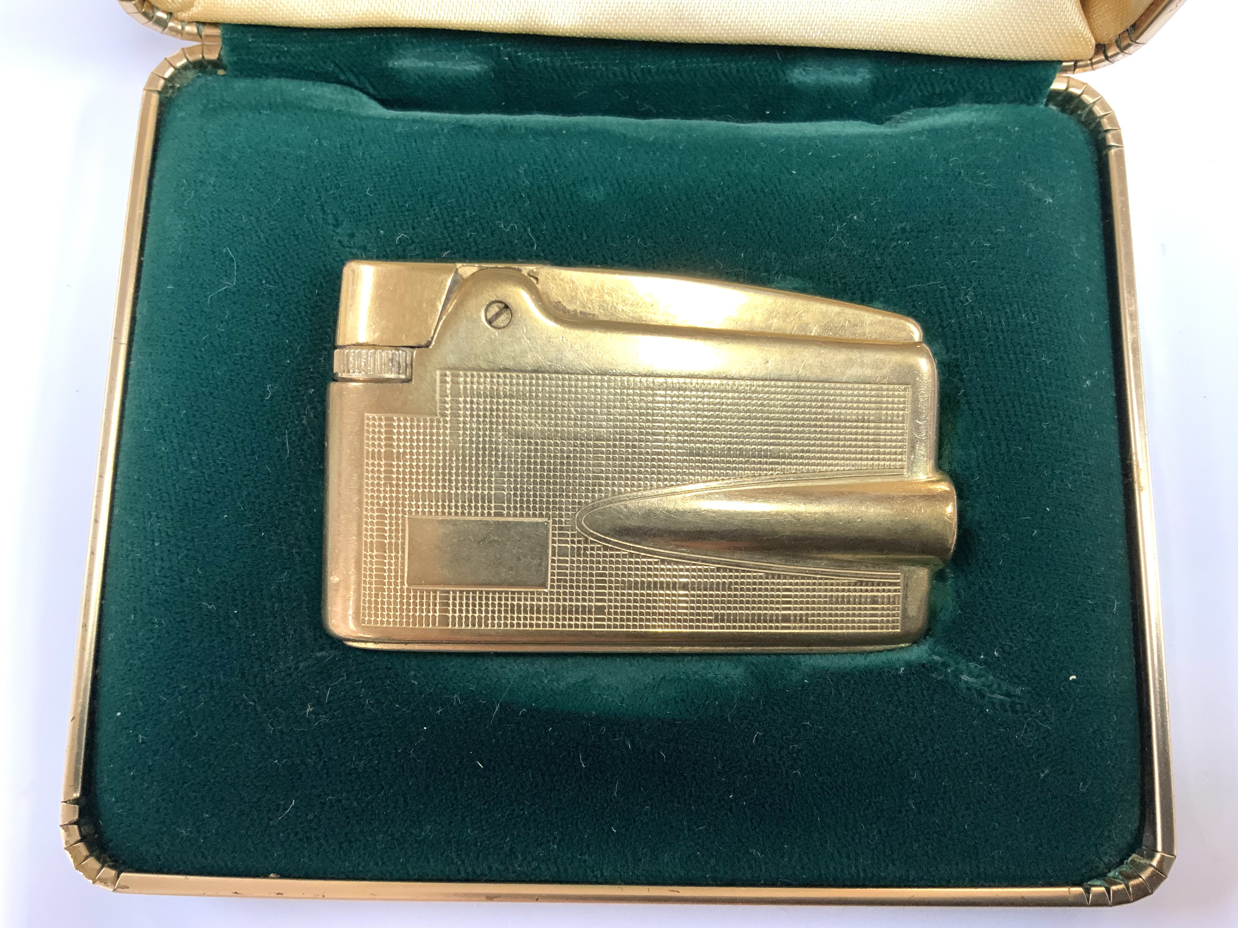 A vintage Ronson Varaflame Adonis 9ct gold sheathed lighter. (A)