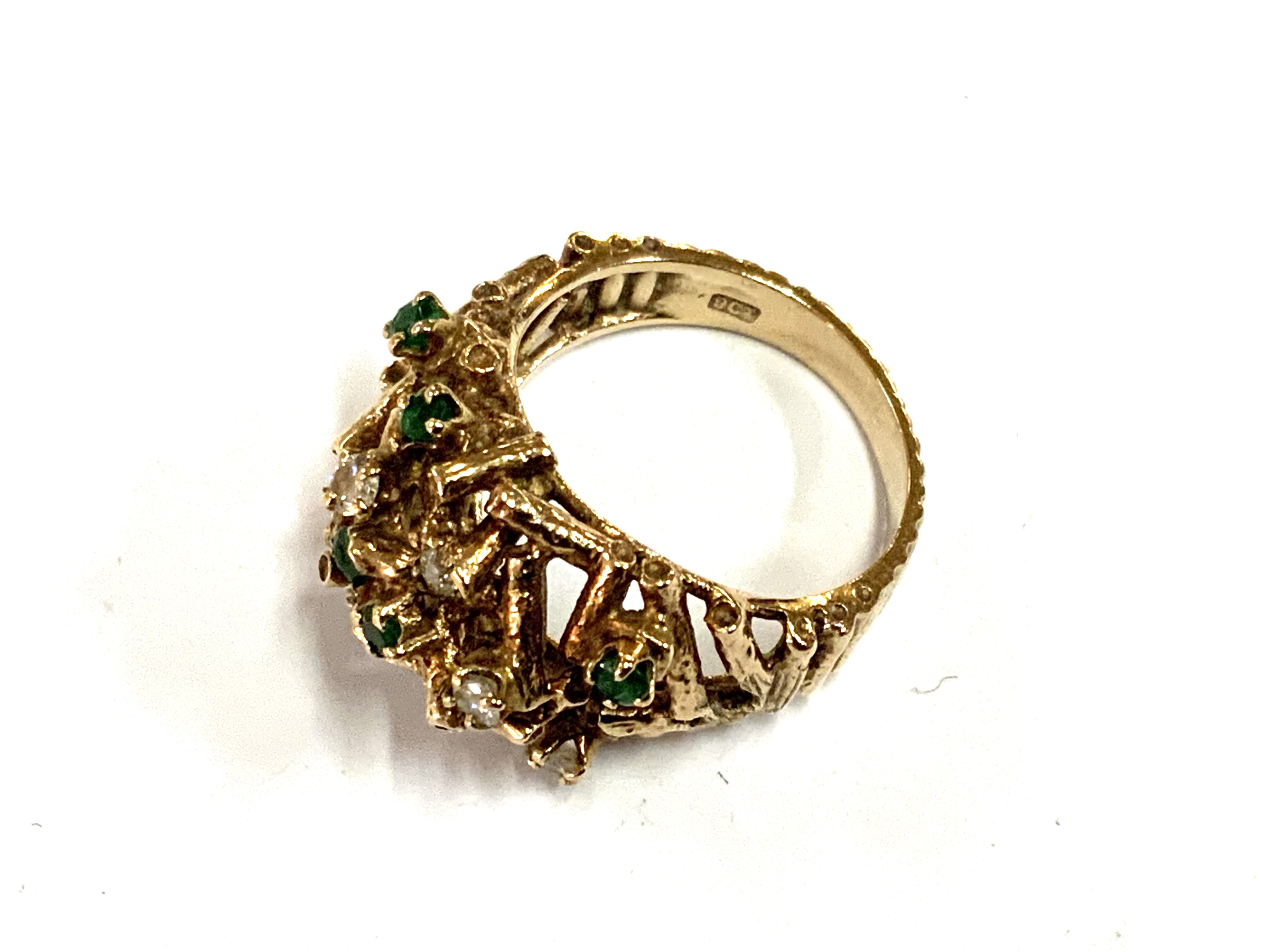 A 1970s cluster design 9ct gold emerald and diamond ring, 7.34g, Size N.5 (A) (1 stone missing).