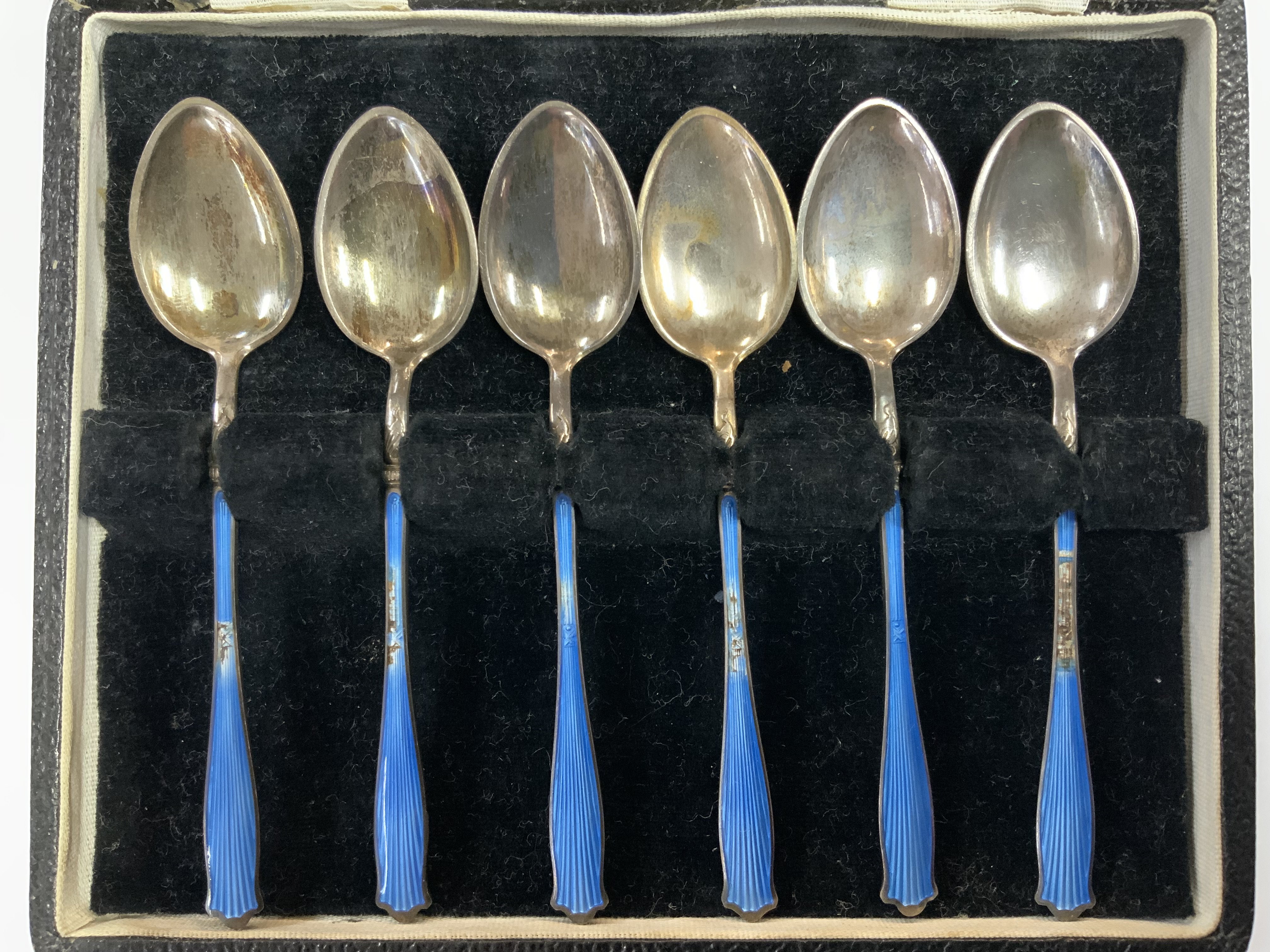 A cased set of Hallmark Silver Guilloche enamel teaspoon set, some damage to the enamel (A)
