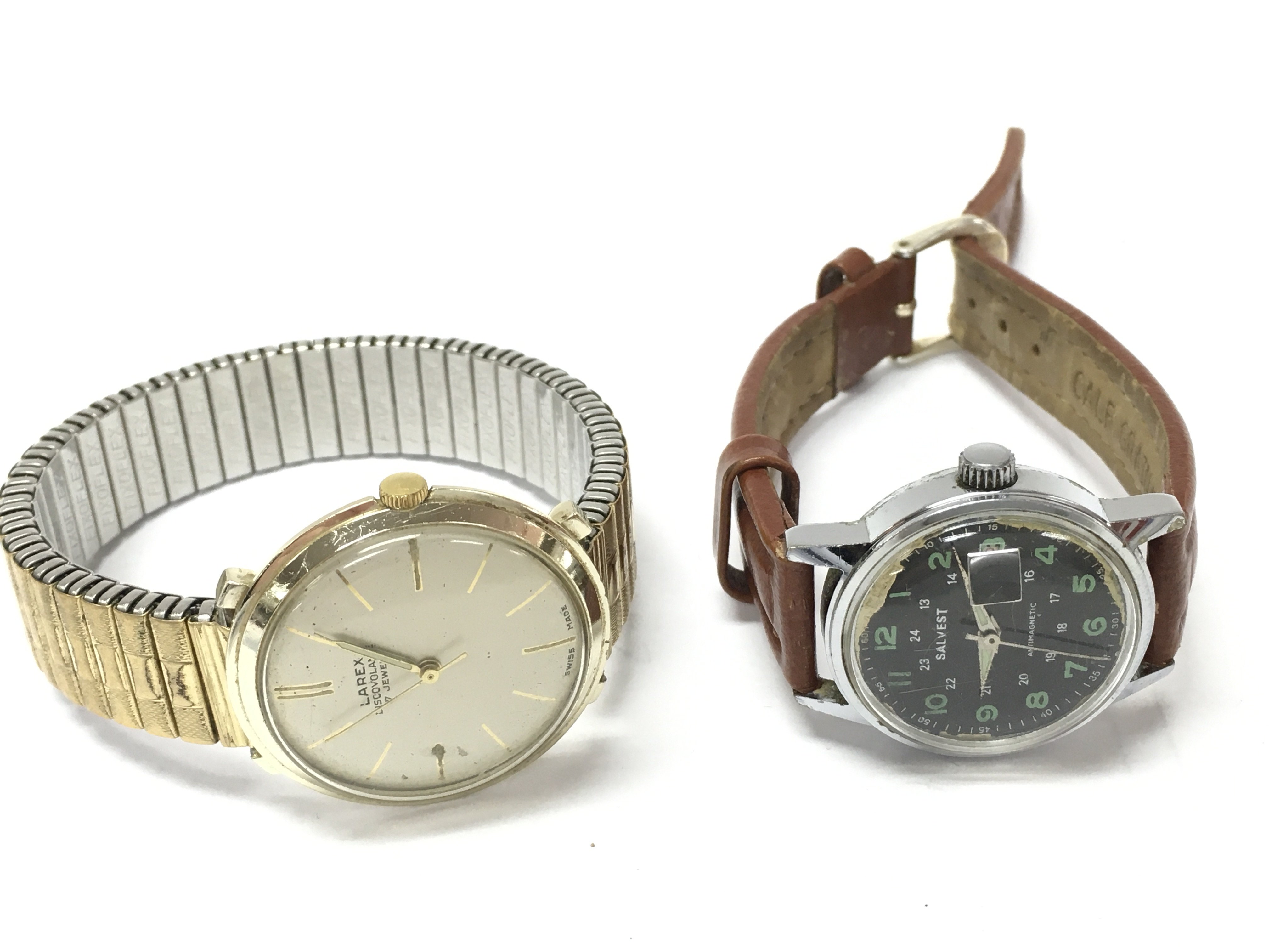 Mens vintage Manual wind watches comprising a Swiss Larex Discovolante 17 jewel watch, 35mm case and a Salvest Anti Magnetic watch. Both seen working. Postage category A