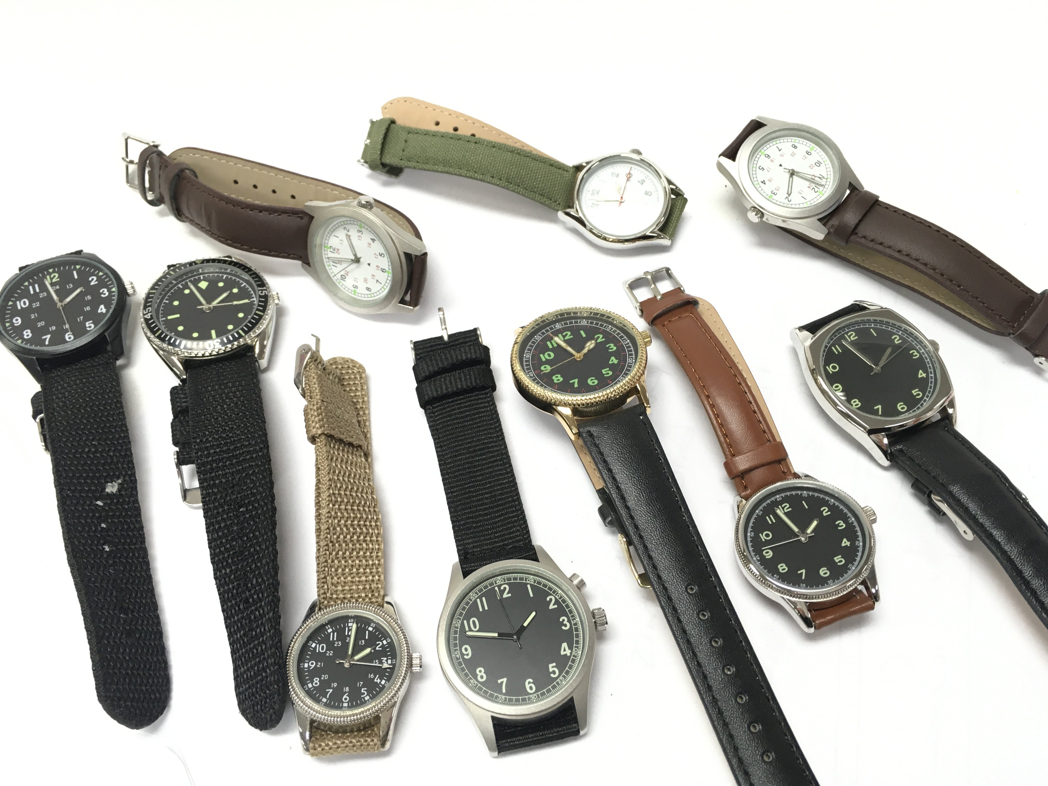 A Collection of military style quartz watches, all seen working. Including US, Czech, Swedish styles etc. postage category B