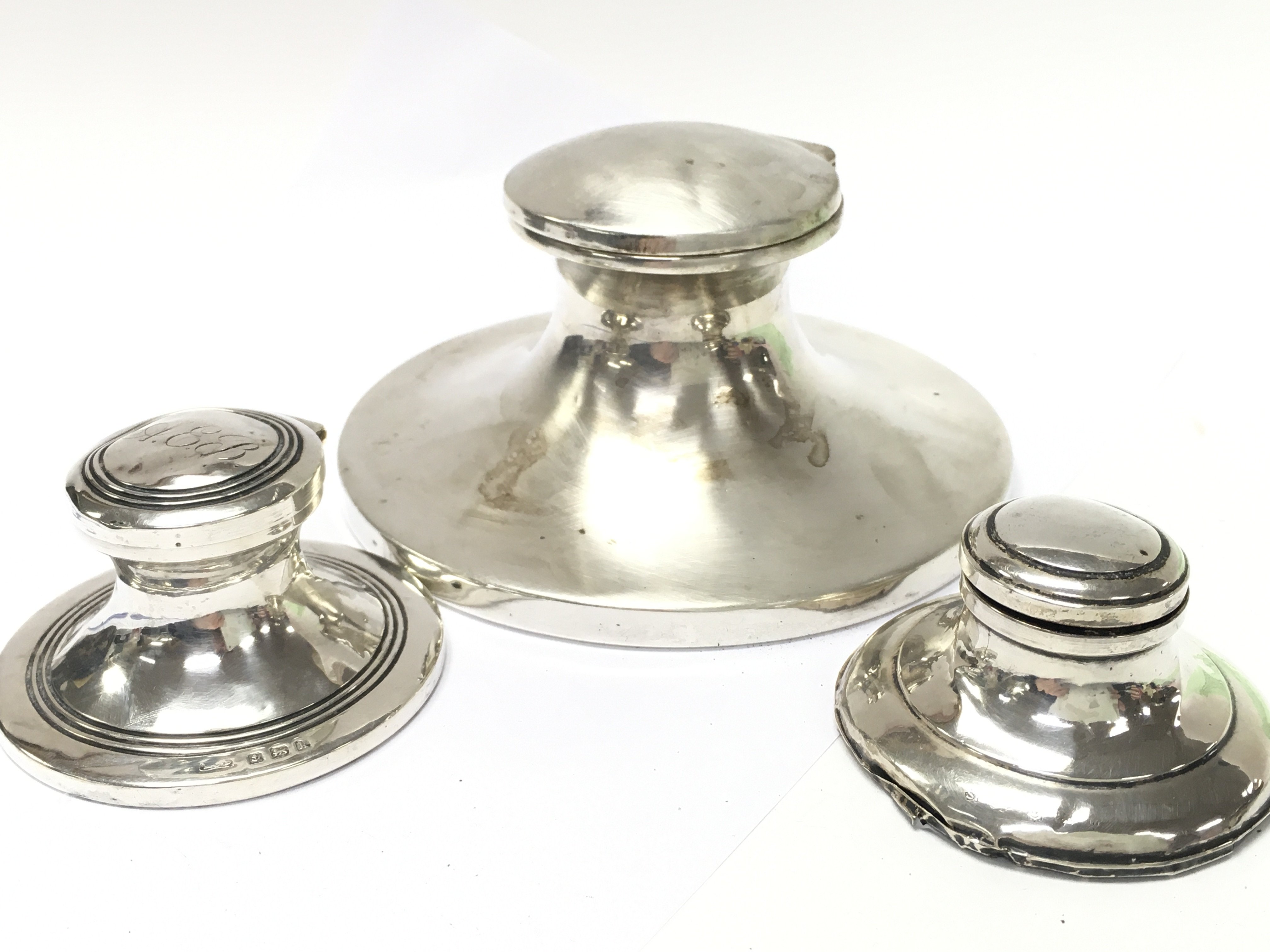 Three silver hallmarked inkwells, total weight 601g