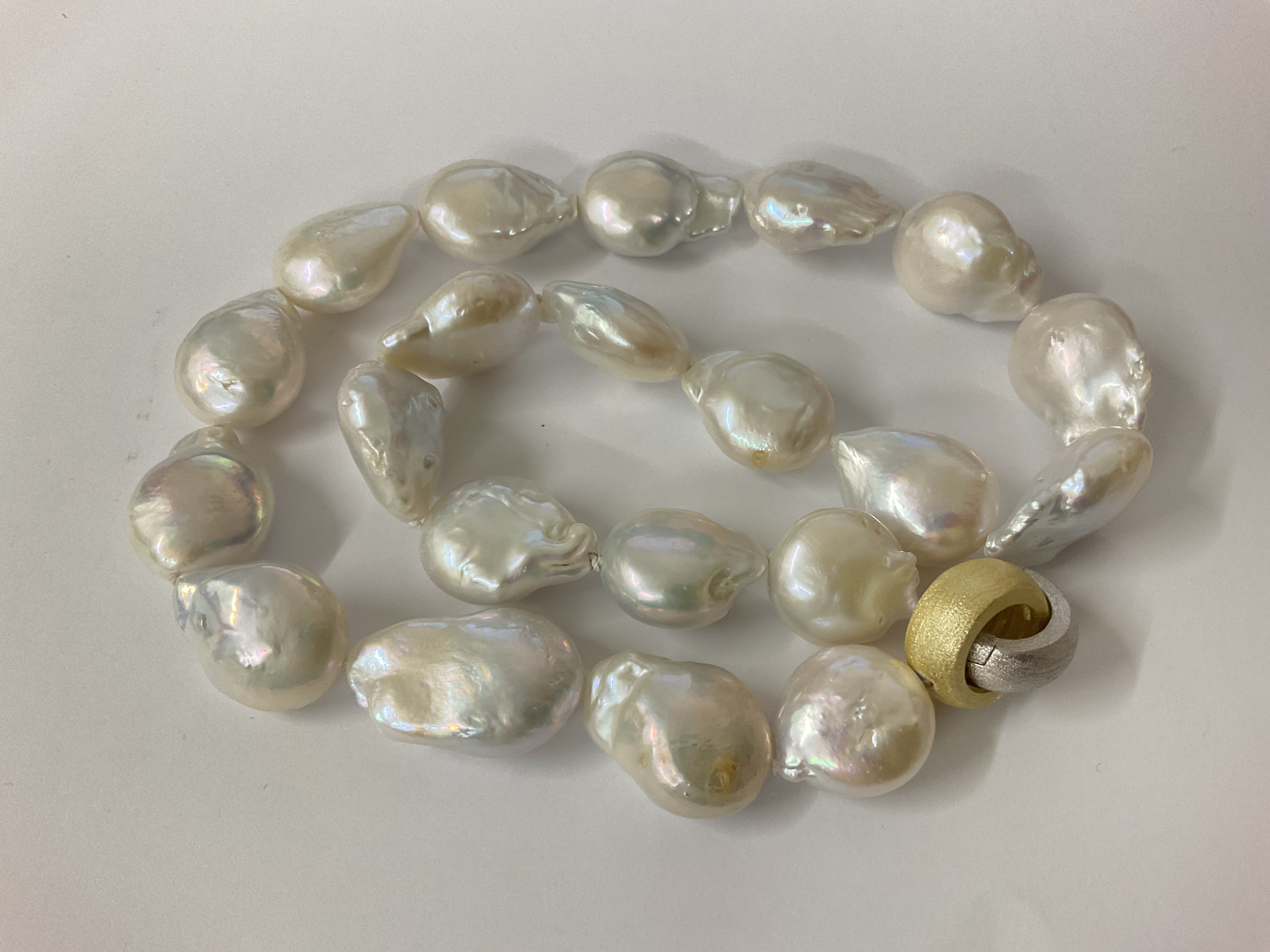 Baroque Pearl necklace with brushed gold plated and silver hooped clap. Postage category A.
