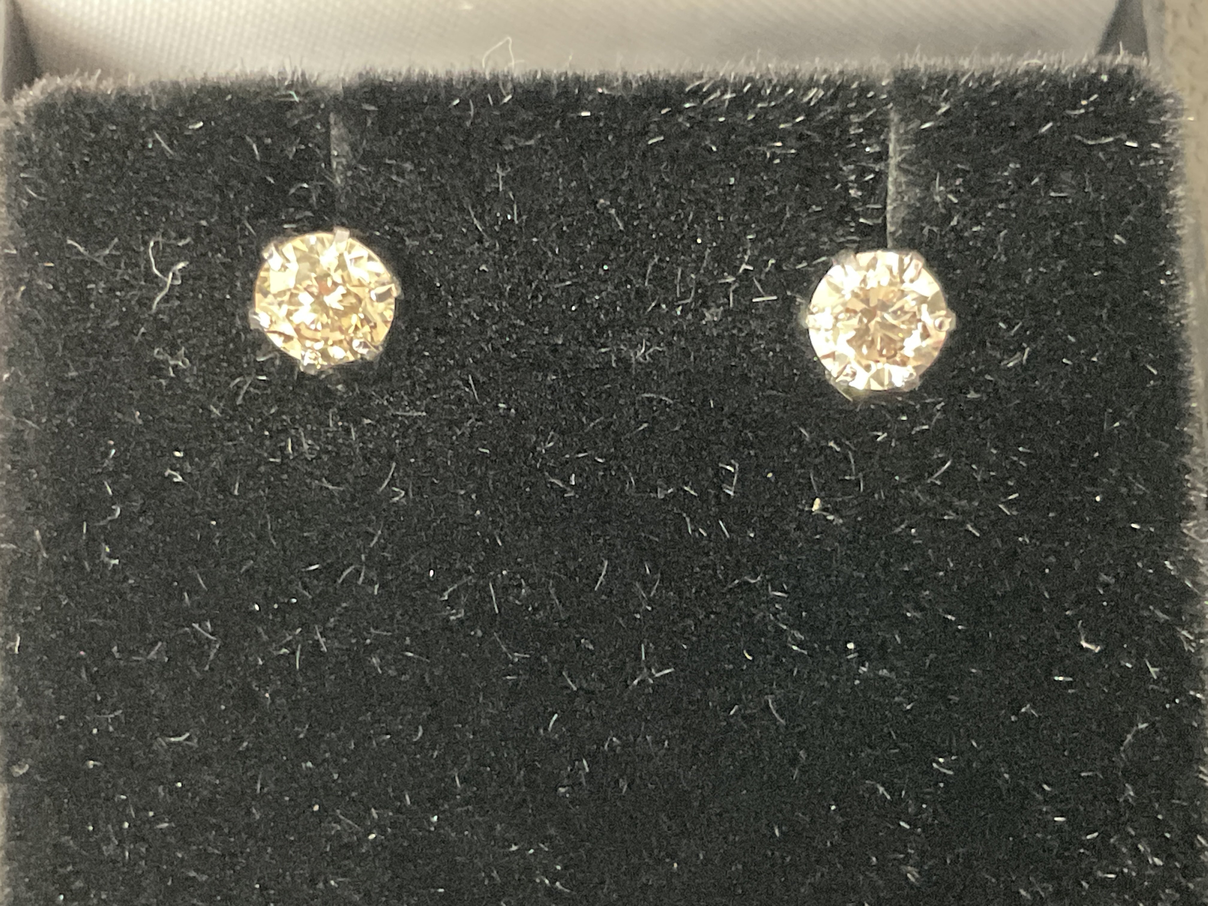 Pair of platinum 6 claw set RBC diamond solitaire studs with silicon capped backs, boxed. Diamonds 0.60ct. Postage category A.