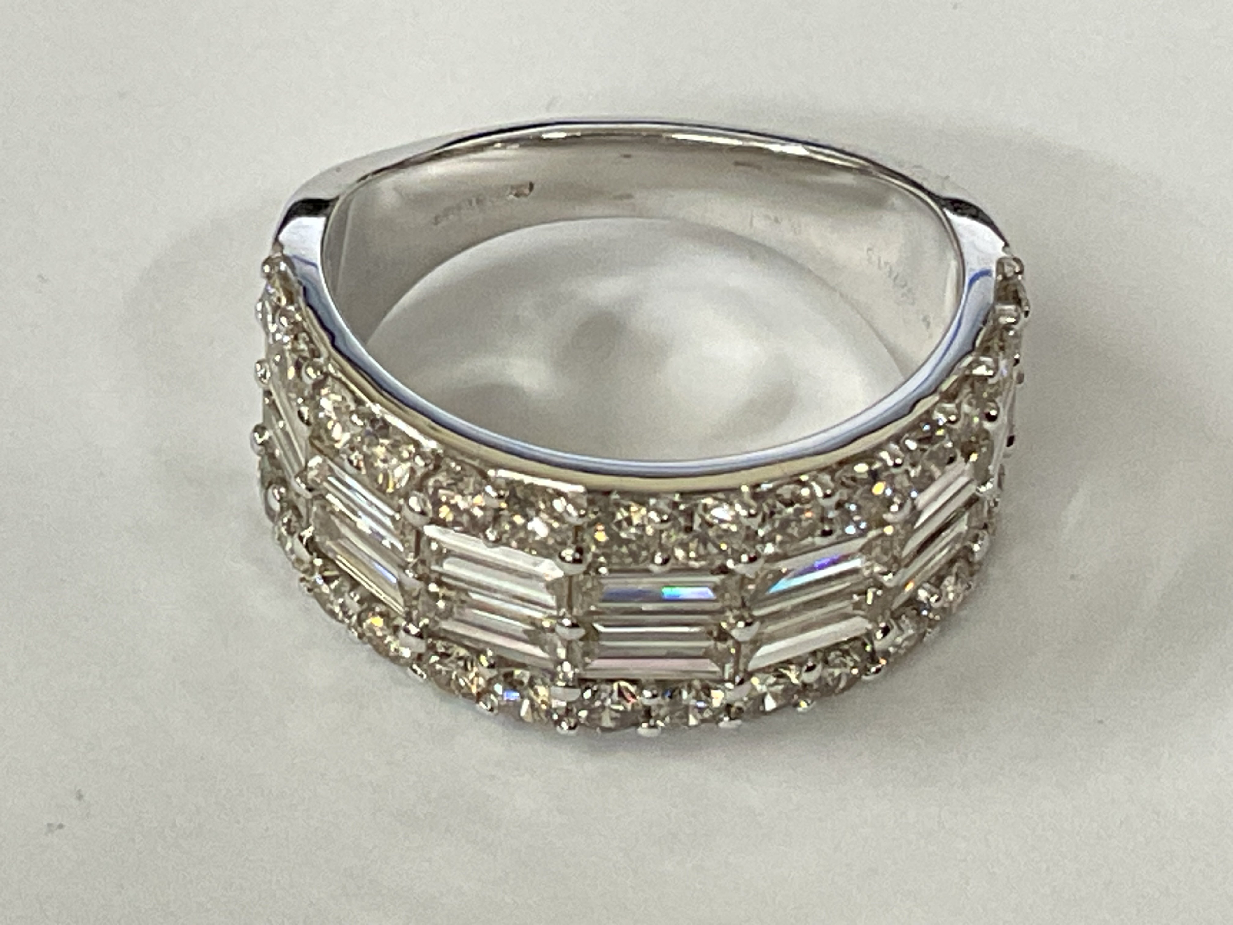 9ct white gold diamond band set with RBC and baguette cut diamonds. Diamonds 2.72ct. Ring size approx M/N.