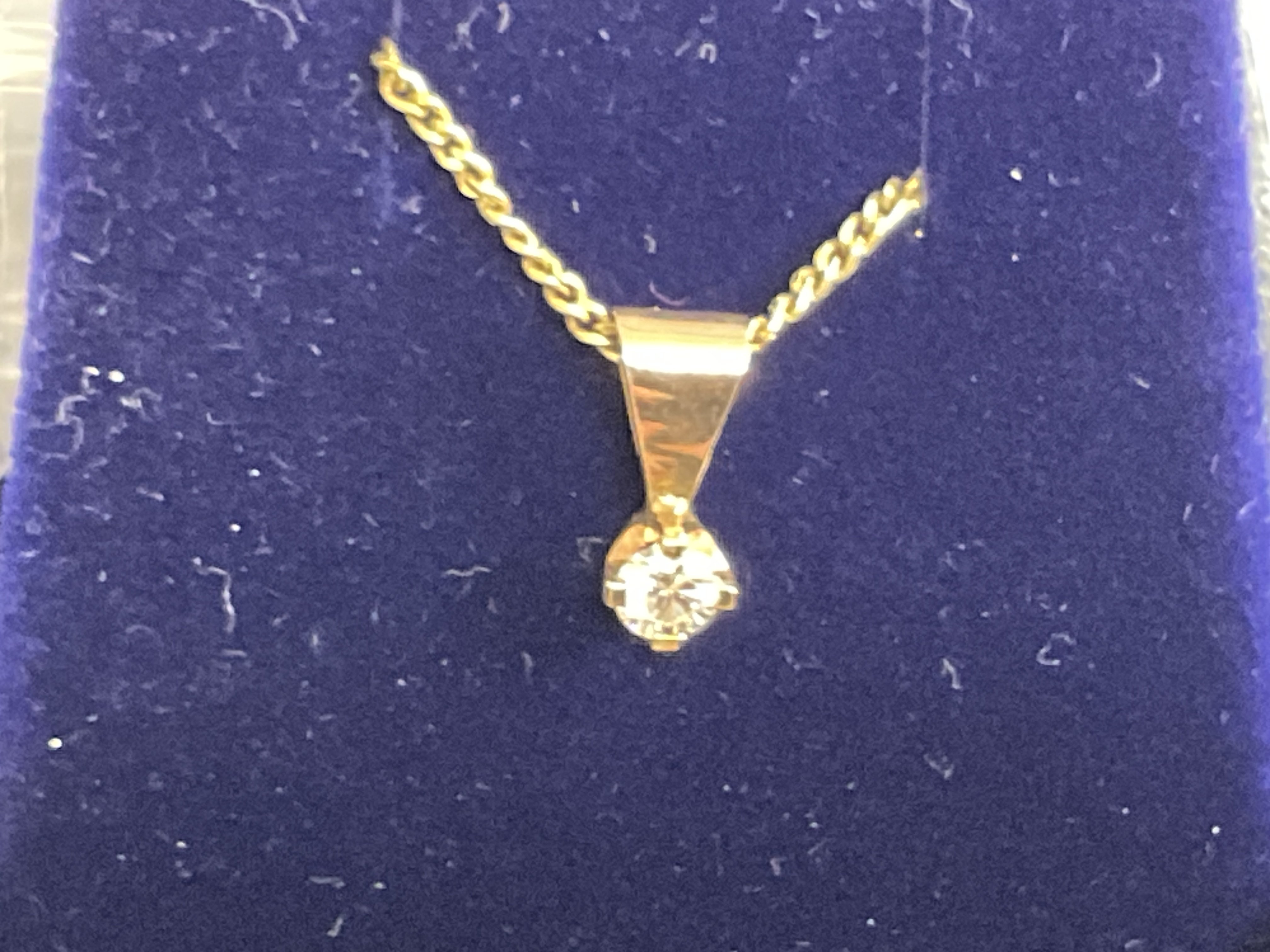 9ct yellow gold solitaire diamond pendant on a gold plated silver chain, boxed. RBC 0.15ct approx. Postage category A.