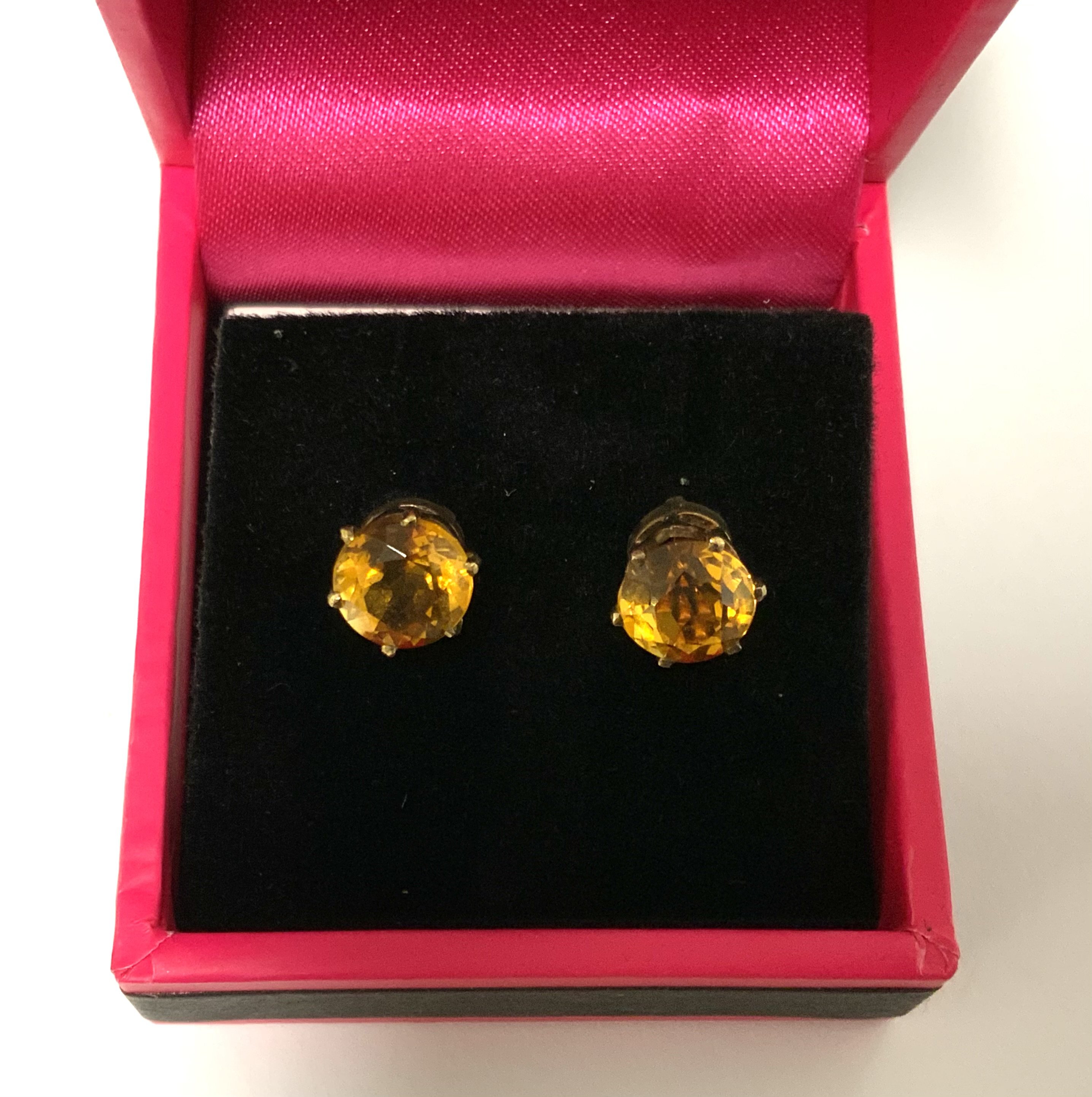 A pair of 9ct gold Spessartite garnet stud earrings (A)